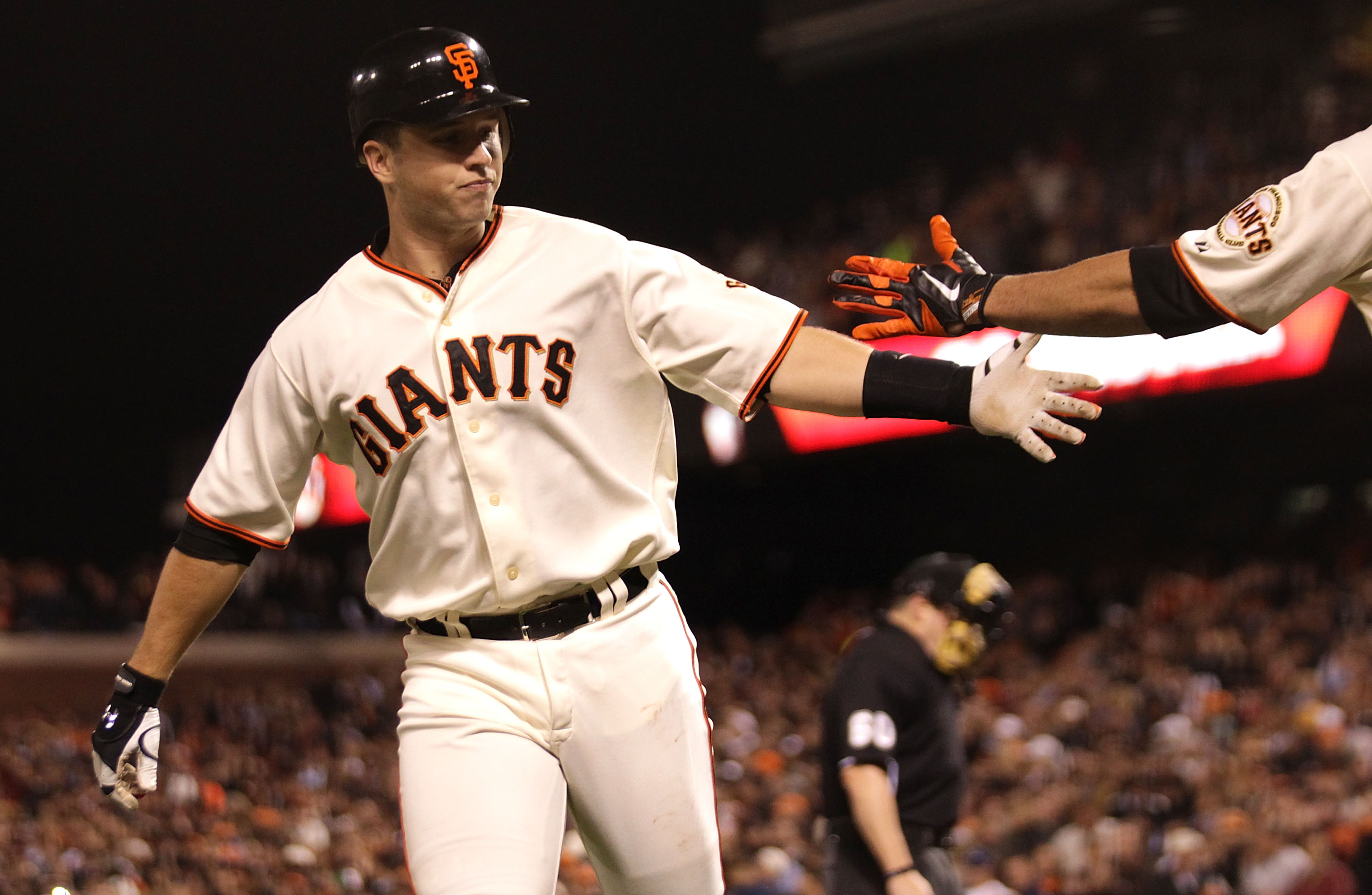 SAN FRANCISCO - SEPTEMBER 16:  Buster Posey #28 of the San Francisco Giants celebrates after hitting a solo home run against the Los Angeles Dodgers in the third inning during a Major League Baseball game at AT&T Park on September 16, 2010 in San Francisc