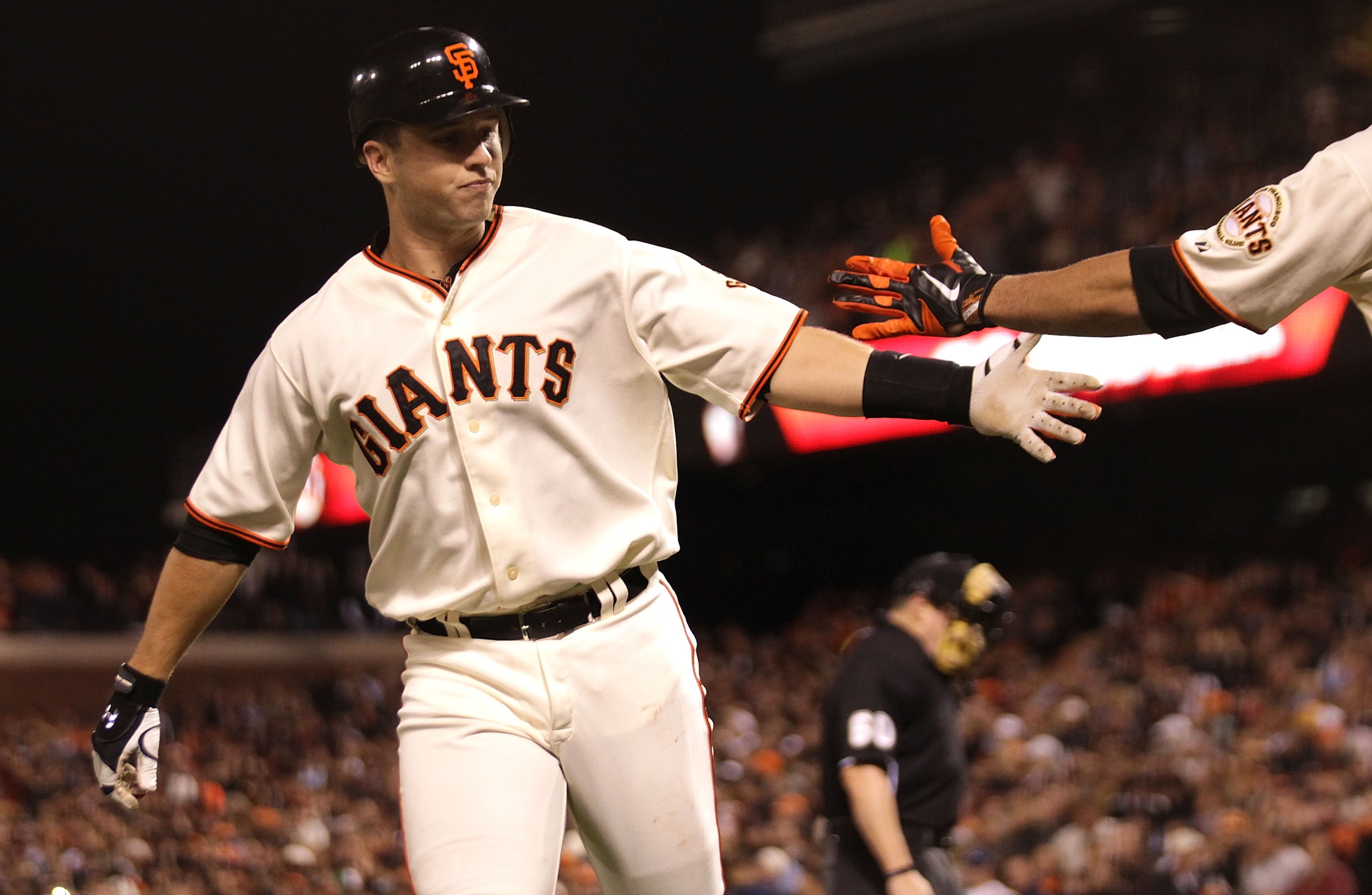 SAN FRANCISCO - SEPTEMBER 16:  Buster Posey #28 of the San Francisco Giants celebrates after hitting a solo home run against the Los Angeles Dodgers in the third inning during a Major League Baseball game at AT&T Park on September 16, 2010 in San Francisc