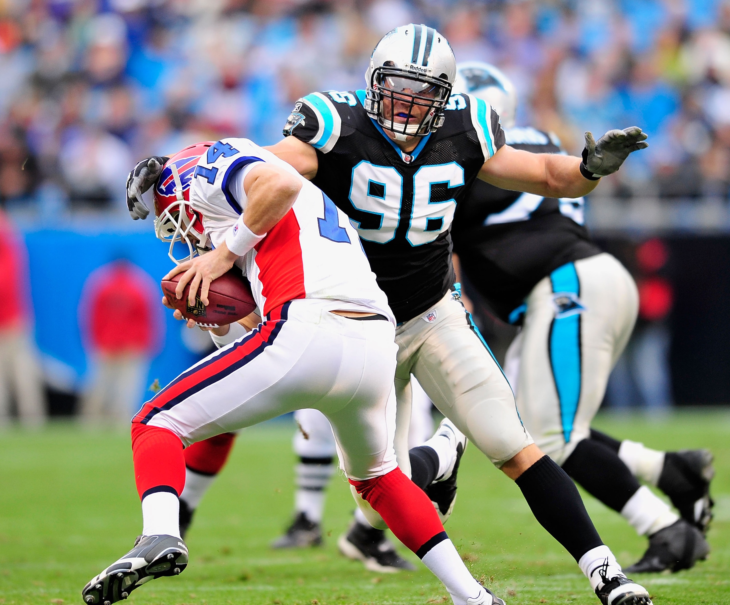 CHARLOTTE, NC - OCTOBER 25:  Tyler Brayton #96 of the Carolina Panthers sacks Ryan Fitzpatrick #14 of the Buffalo Bills during the second quarter at Bank of America Stadium on October 25, 2009 in Charlotte, North Carolina.  (Photo by Grant Halverson/Getty