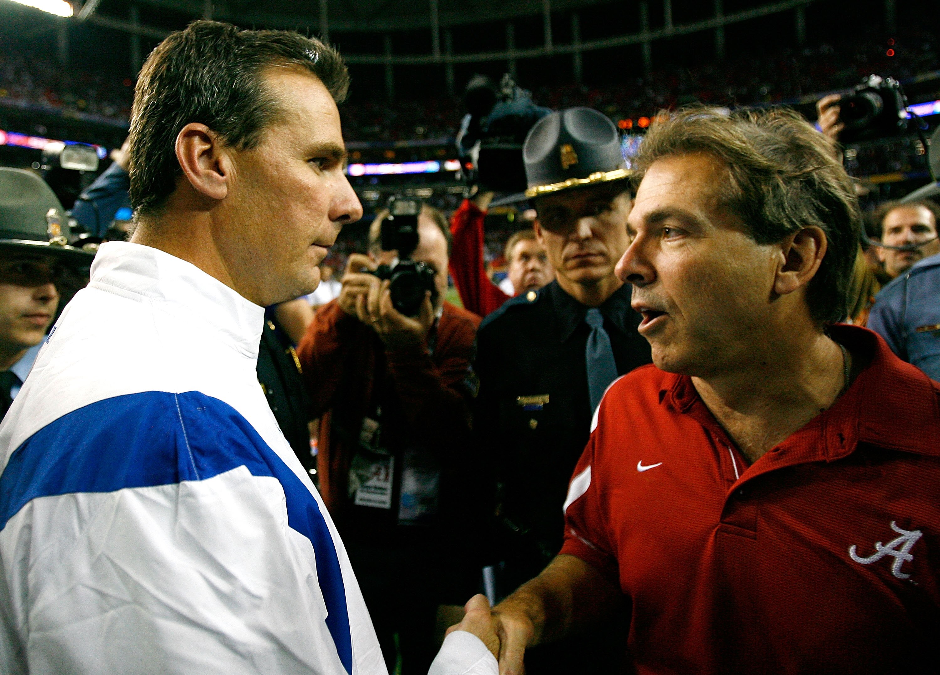 ATLANTA - DECEMBER 06:  Head coach Nick Saban of the Alabama Crimson Tide congratulates head coach Urban Meyer of the Florida Gators after the Gators 31-20 win in the SEC Championship on December 6, 2008 at the Georgia Dome in Atlanta, Georgia.  (Photo by
