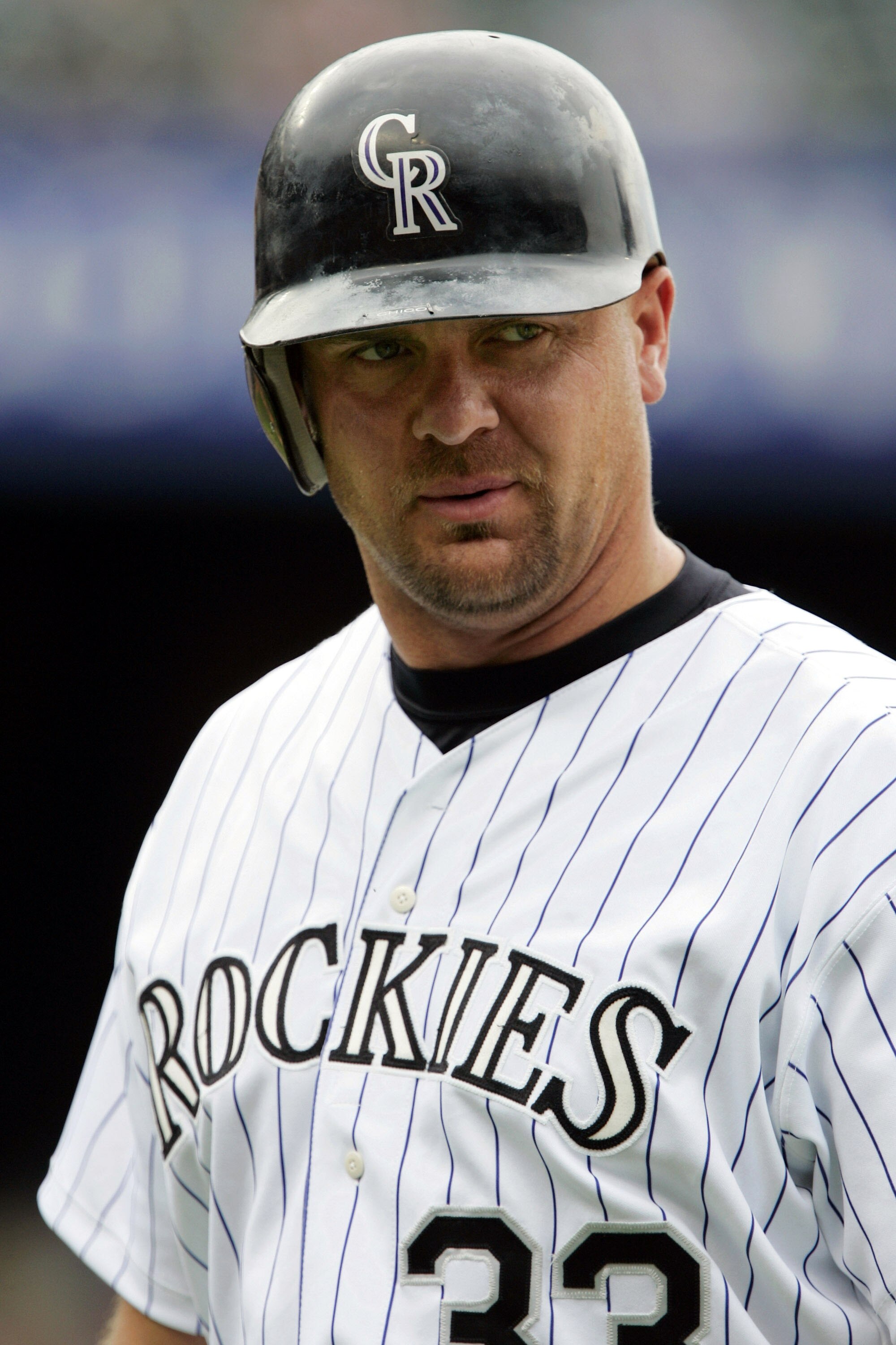 DENVER - JULY 4:  Larry Walker #33 of the Colorado Rockies walks back to the dugout after pinch-hitting against the Detroit Tigers on July 4, 2004 at Coors Field in Denver, Colorado. The Rockies came from behind to sweep the Tigers with a 10-8 win.  (Phot