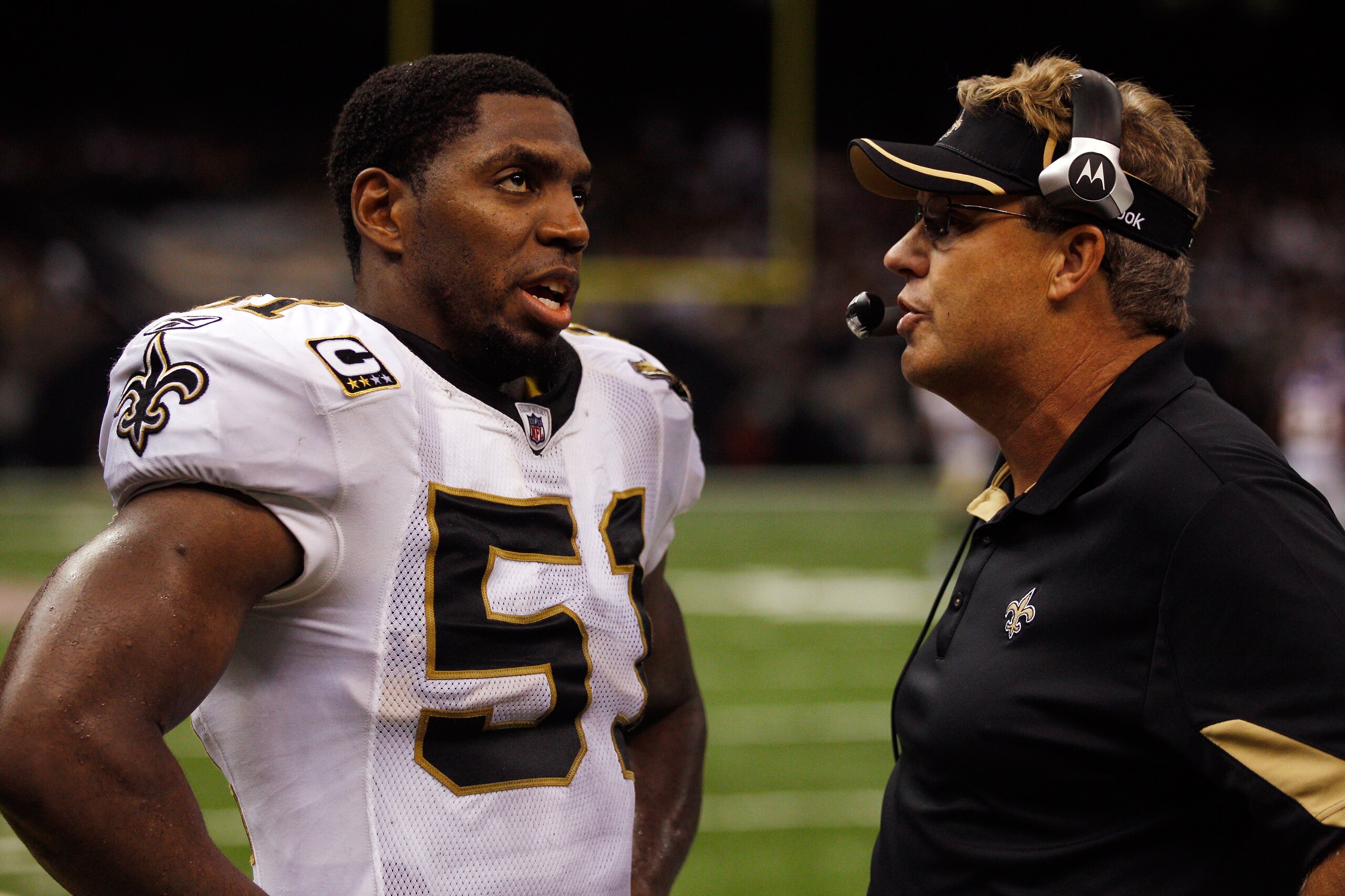 NEW ORLEANS - SEPTEMBER 09:  Jonathan Vilma #51 talks with Gregg Williams of the New Orleans Saints during the game against the Minnesota Vikings at Louisiana Superdome on September 9, 2010 in New Orleans, Louisiana.  (Photo by Chris Graythen/Getty Images