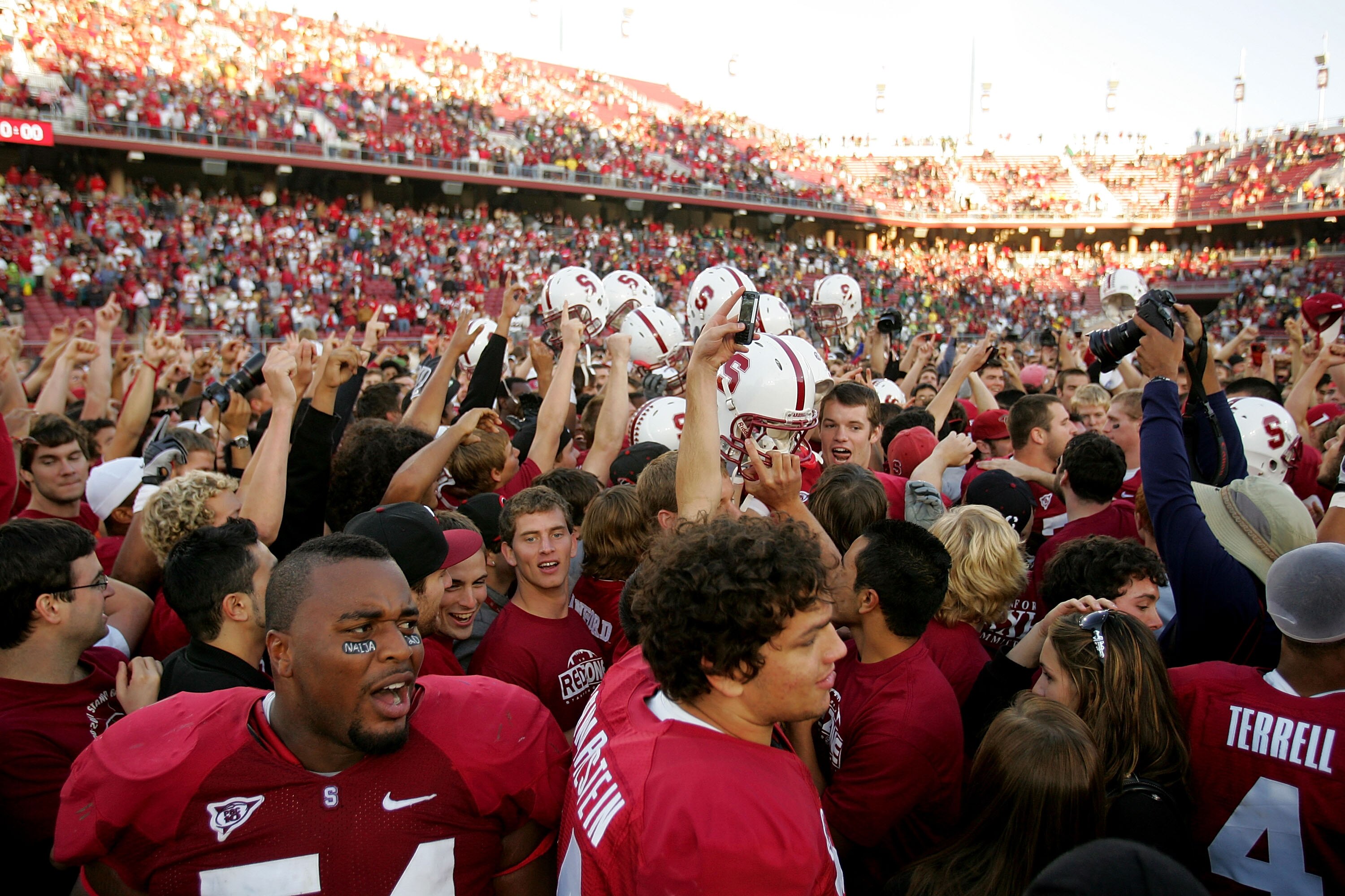PALO ALTO, CA - NOVEMBER 07:  The Stanford Cardinal celebrate with fans after they upset the Oregon Ducks at Stanford Stadium on November 7, 2009 in Palo Alto, California.  (Photo by Ezra Shaw/Getty Images)