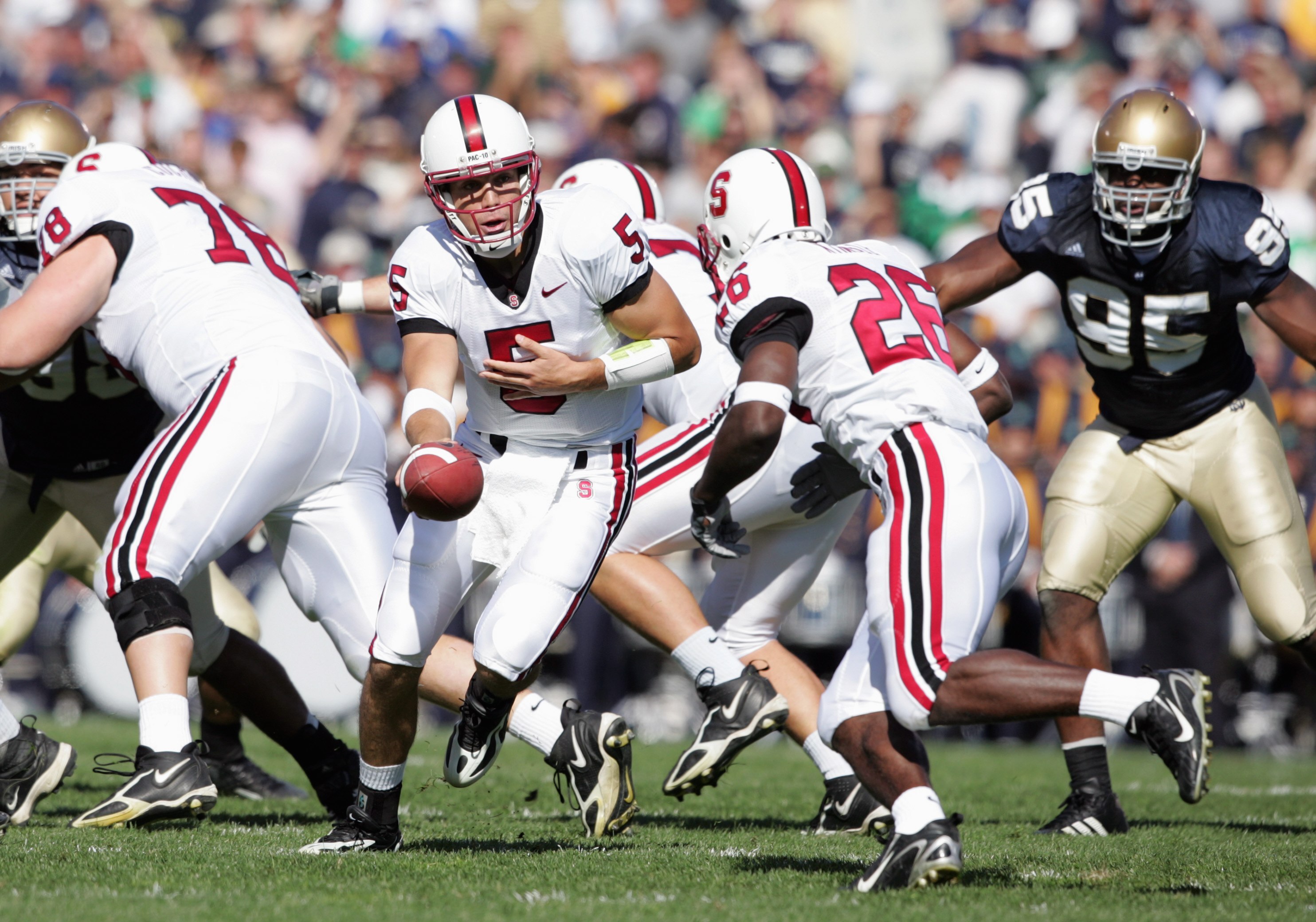 SOUTH BEND, IN - OCTOBER 07:  Quarterback Trent Edwards #5 of the Stanford Cardinal moves to hand off the ball to Anthony Kimble #26 during the game against the Notre Dame Fighting Irish on October 7, 2006 at Notre Dame Stadium in South Bend, Indiana. (Ph
