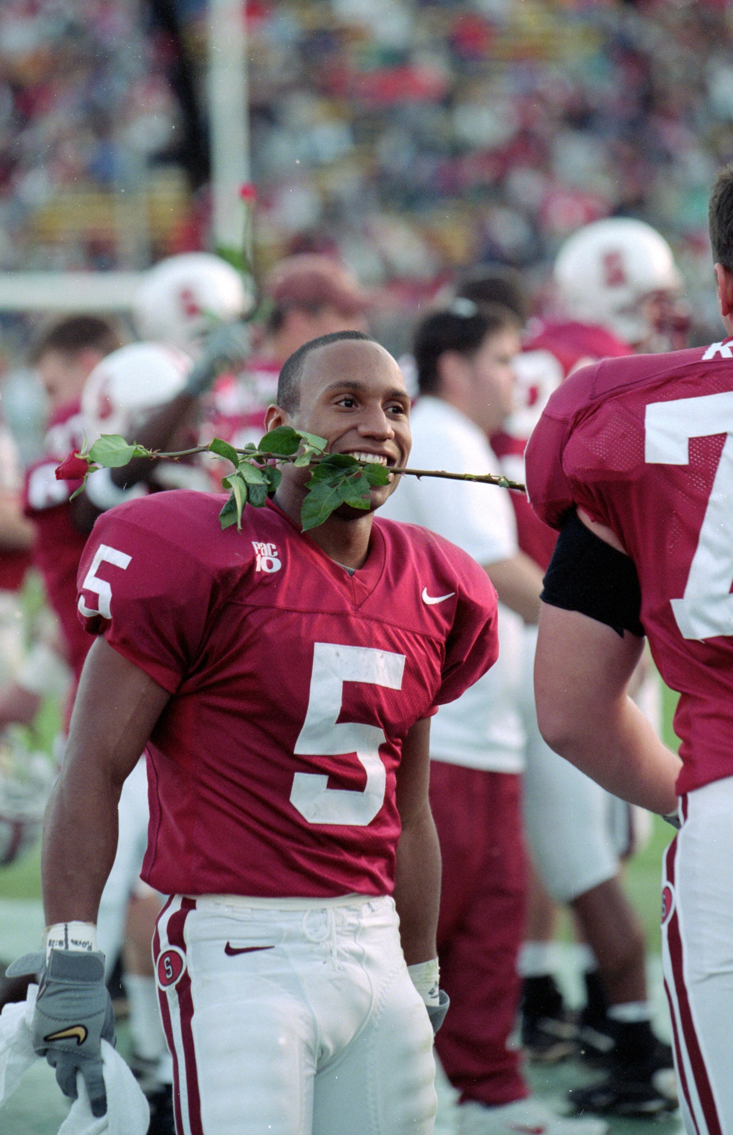 20 Nov 1999: Troy Walters #5 of the Stanford Cardinals holds a rose in his teeth as a sign that they are Rose Bowl bound during a game against the Cal Golden Bears at the Stanford Stadium in Palo Alto, California. The Cardinals defeated the Golden Bears 3