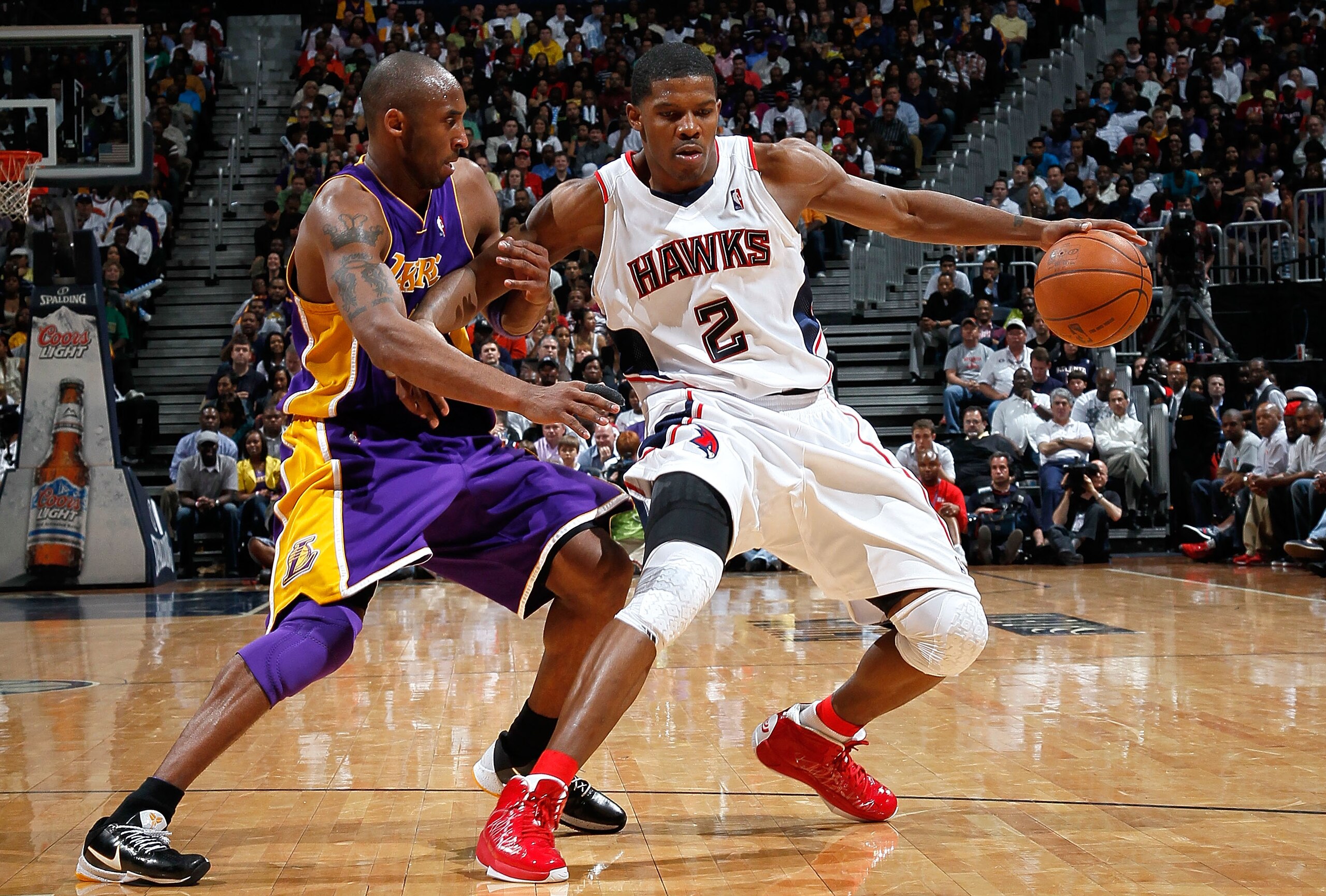 ATLANTA - MARCH 31:  Joe Johnson #2 of the Atlanta Hawks drives against Kobe Bryant #24 of the Los Angeles Lakers at Philips Arena on March 31, 2010 in Atlanta, Georgia.  NOTE TO USER: User expressly acknowledges and agrees that, by downloading and/or usi