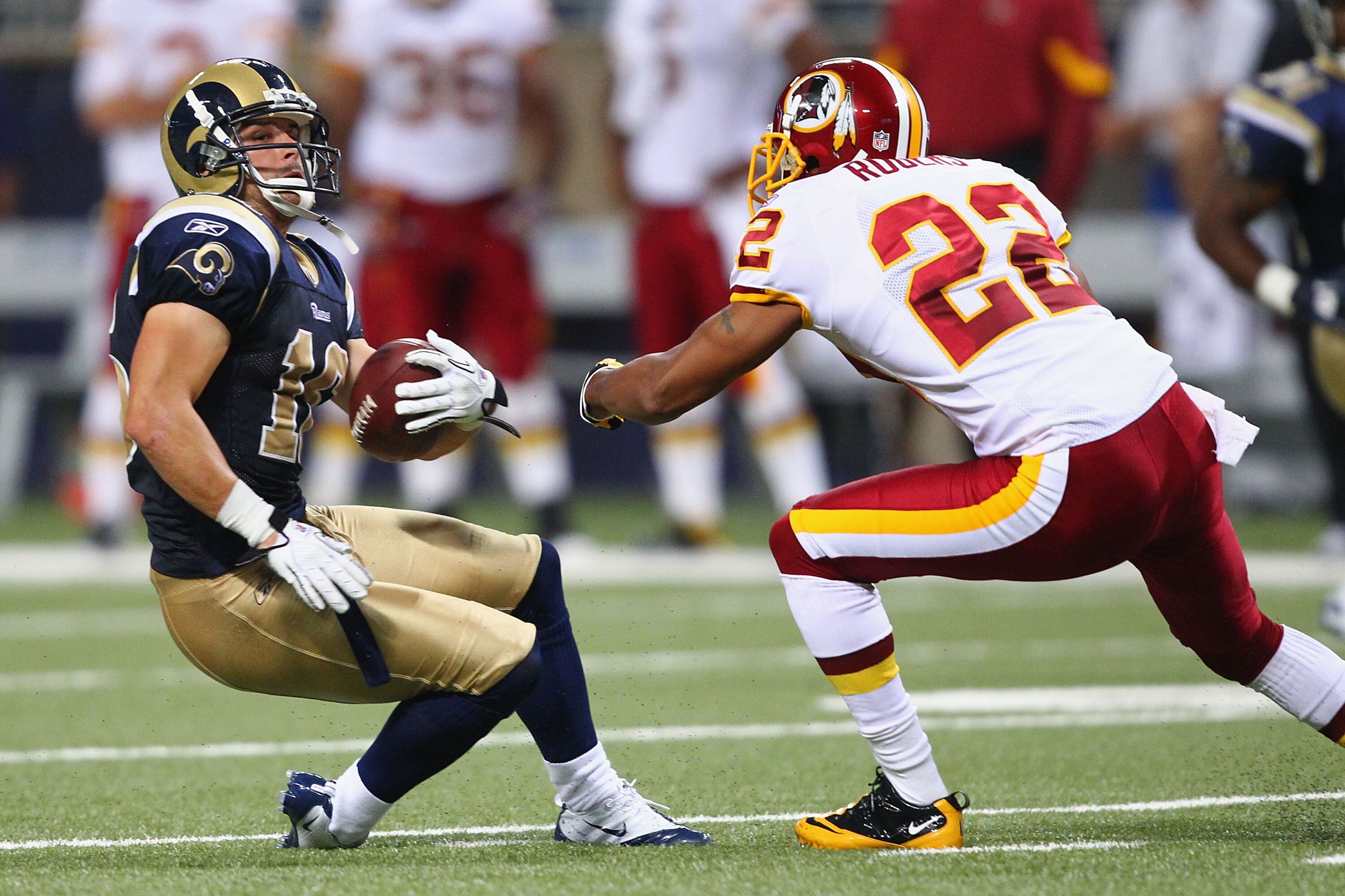 ST. LOUIS - SEPTEMBER 26: Danny Amendola #16 of the St. Louis Rams looks to avoid Carlos Rogers #22 of the Washington Redskins at the Edward Jones Dome on September 26, 2010 in St. Louis, Missouri.  The Rams beat the Redskins 30-16.  (Photo by Dilip Vishw