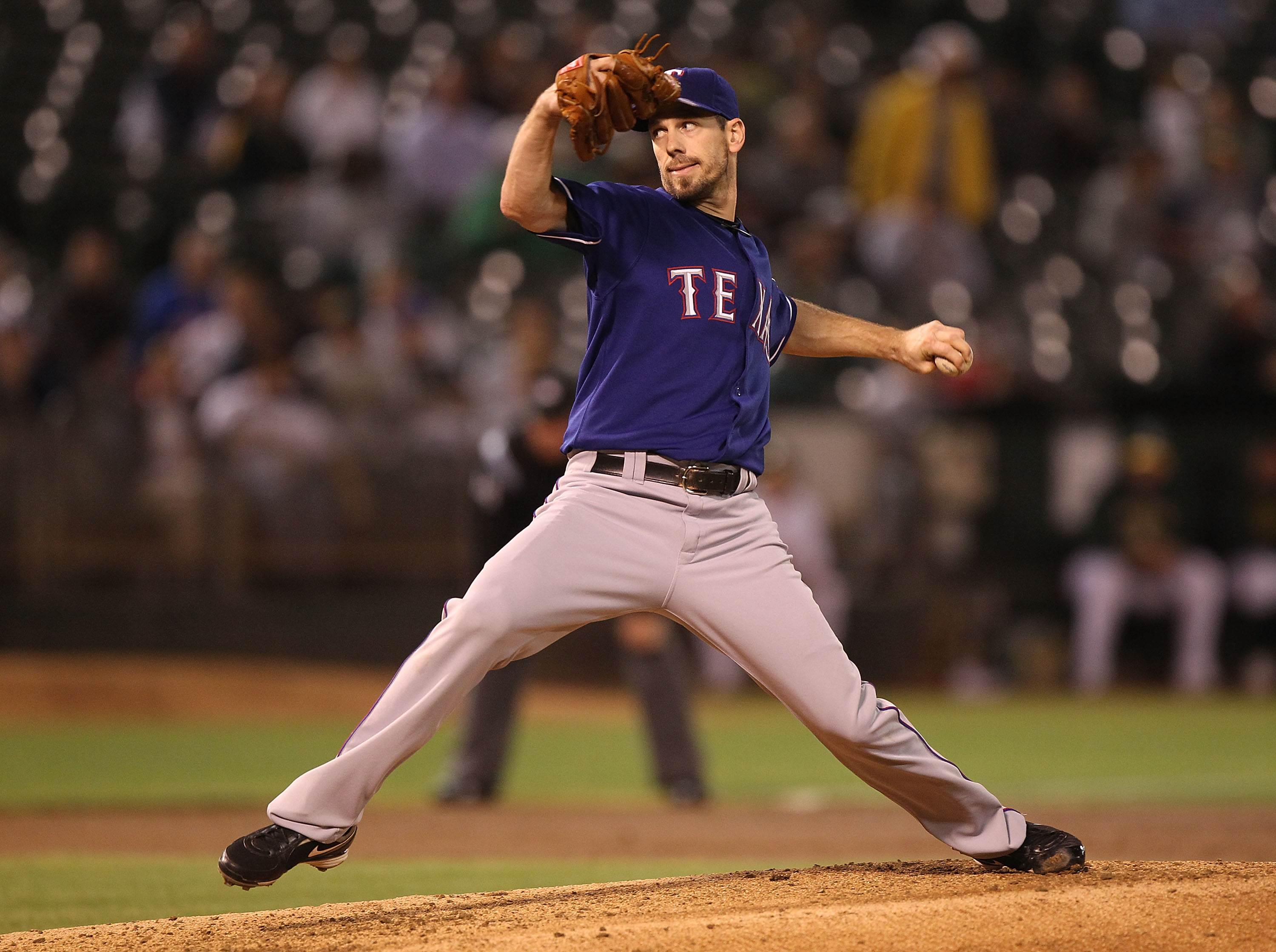 OAKLAND, CA - SEPTEMBER 23:  Cliff Lee #33 of the Texas Rangers pitches against the Oakland Athletics during a Major League Baseball game at the Oakland-Alameda County Coliseum on September 23, 2010 in Oakland, California.  (Photo by Jed Jacobsohn/Getty I