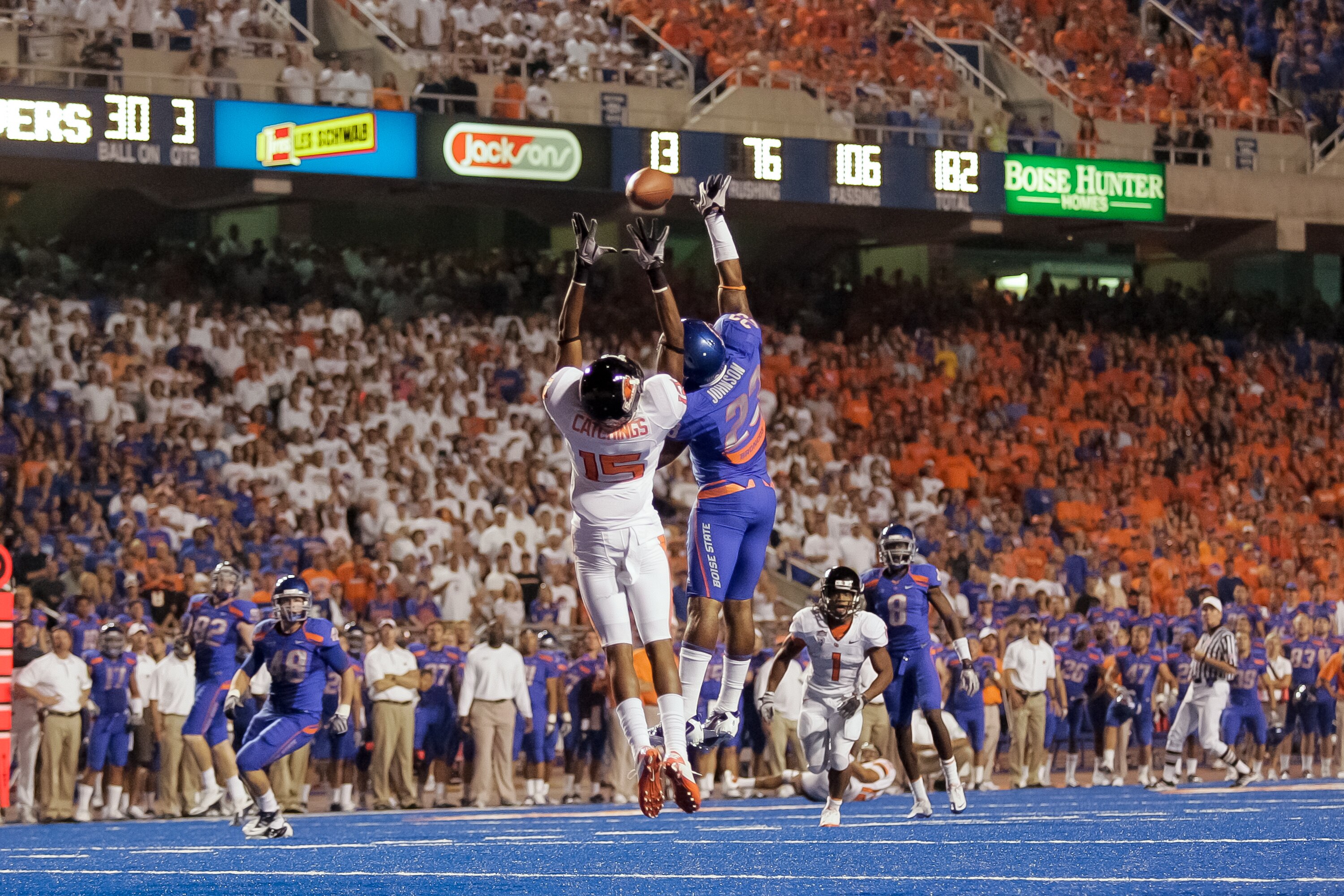 BOISE, ID - SEPTEMBER 25:  Wide receiver Darrell Catchings #15 of the Oregon State Beavers goes up for a catch over safety Jeron Johnson #23 of the Boise State Broncos at Bronco Stadium on September 25, 2010 in Boise, Idaho.  (Photo by Otto Kitsinger III/