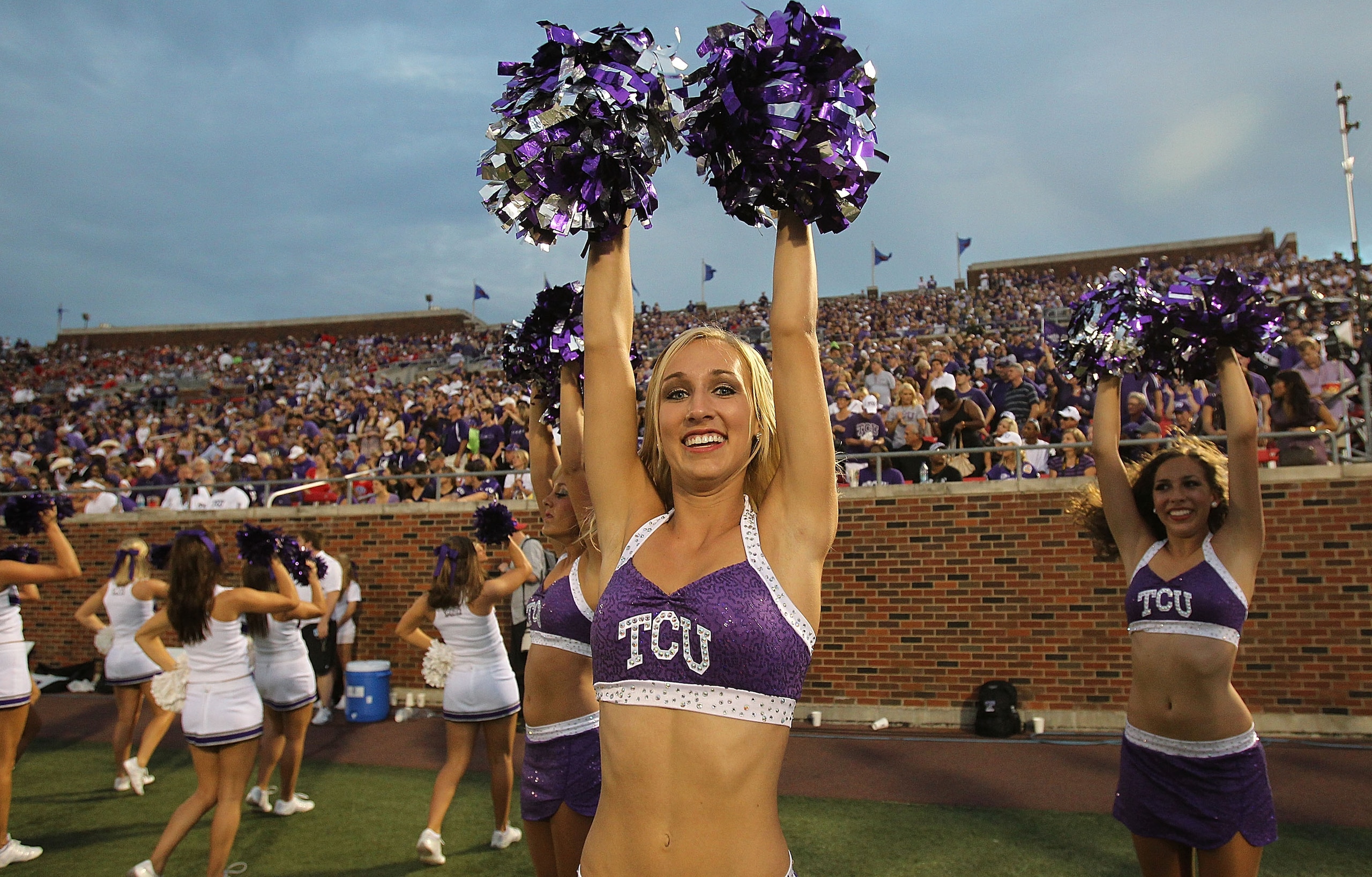 DALLAS - SEPTEMBER 24: A TCU Horned Frogs cheerleader performs at Gerald J. Ford Stadium on September 24, 2010 in Dallas, Texas.  (Photo by Ronald Martinez/Getty Images)
