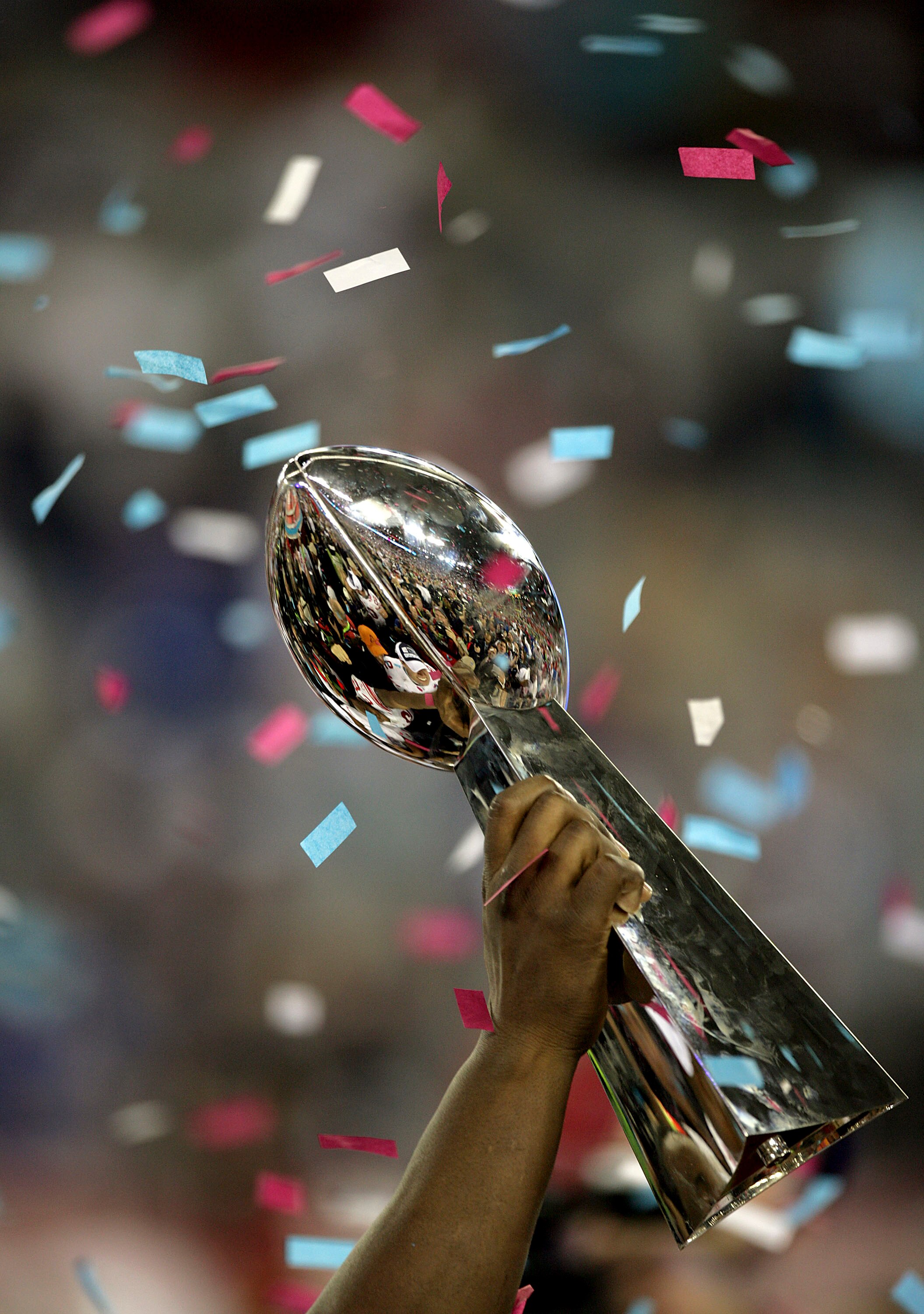GLENDALE, AZ - FEBRUARY 03:  A player holds the Vince Lombardi Trophy after the New York Giants defeated the New England Patriots 17-14 after Super Bowl XLII on February 3, 2008 at the University of Phoenix Stadium in Glendale, Arizona.  (Photo by Donald 