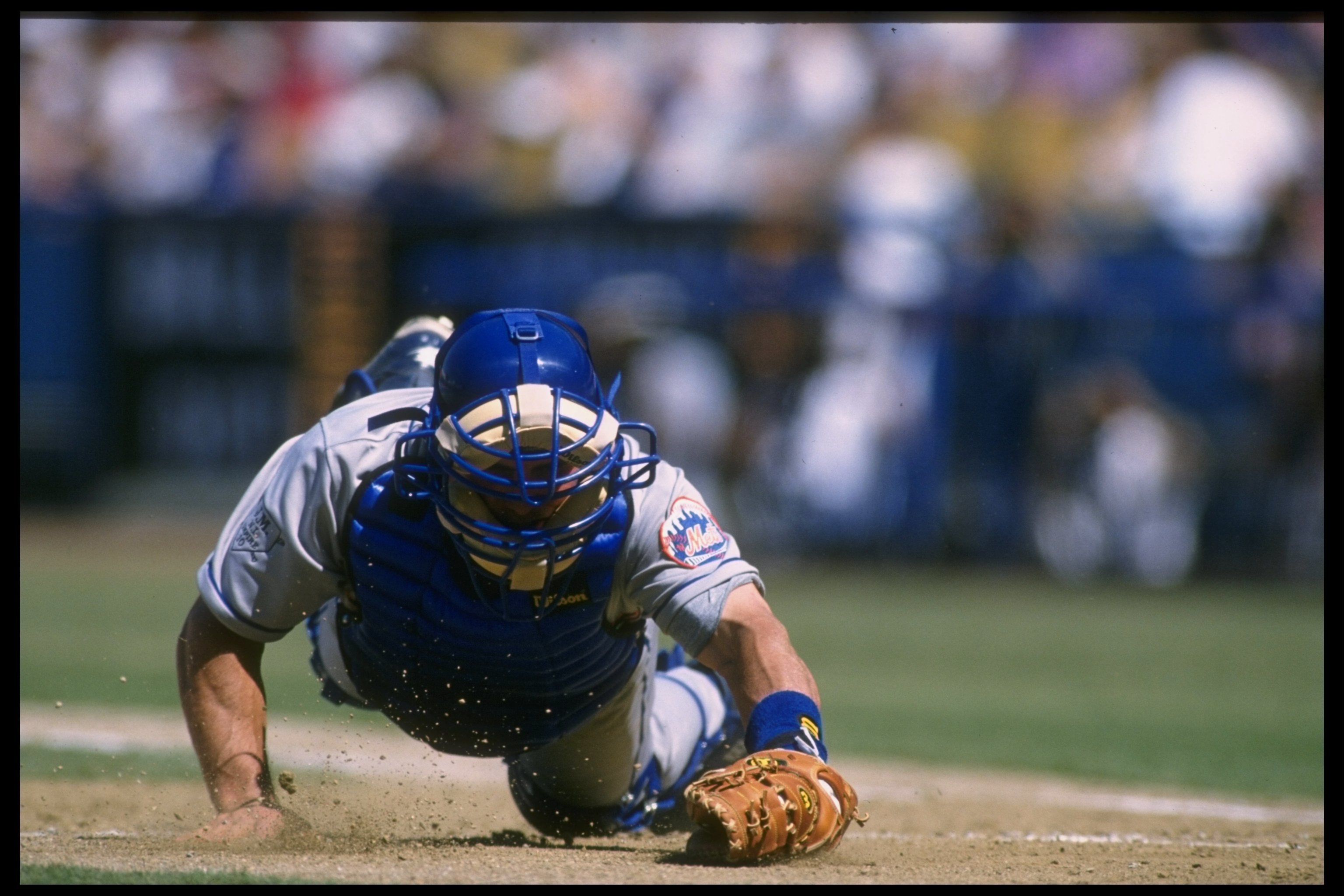 24 Aug 1996:  Catcher Todd Hundley of the New York Mets falls on the field during a game against the Los Angeles Dodgers at Dodger Stadium in Los Angeles, California.  The Dodgers won the game, 7-5. Mandatory Credit: Stephen Dunn  /Allsport