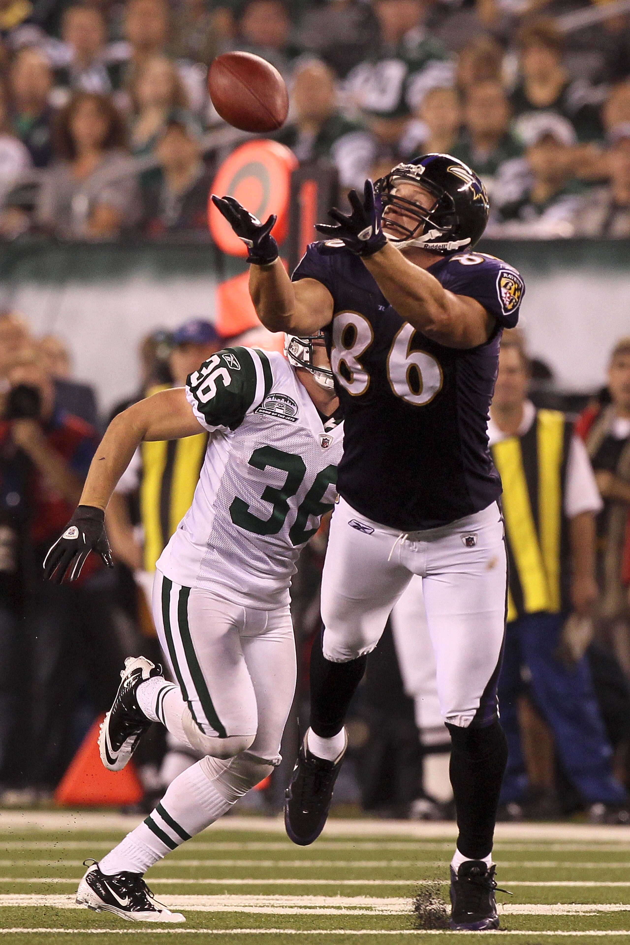 EAST RUTHERFORD, NJ - SEPTEMBER 13: Todd Heap #86 of the Baltimore Ravens catches a pass over Jim Leonhard #36 of the New York Jets during their home opener at the New Meadowlands Stadium on September 13, 2010 in East Rutherford, New Jersey. (Photo by J EAST RUTHERFORD, NJ - SEPTEMBER 13: Todd Heap #86 of the Baltimore Ravens catches a pass over Jim Leonhard #36 of the New York Jets during their home opener at the New Meadowlands Stadium on September 13, 2010 in East Rutherford, New Jersey. (Photo by J