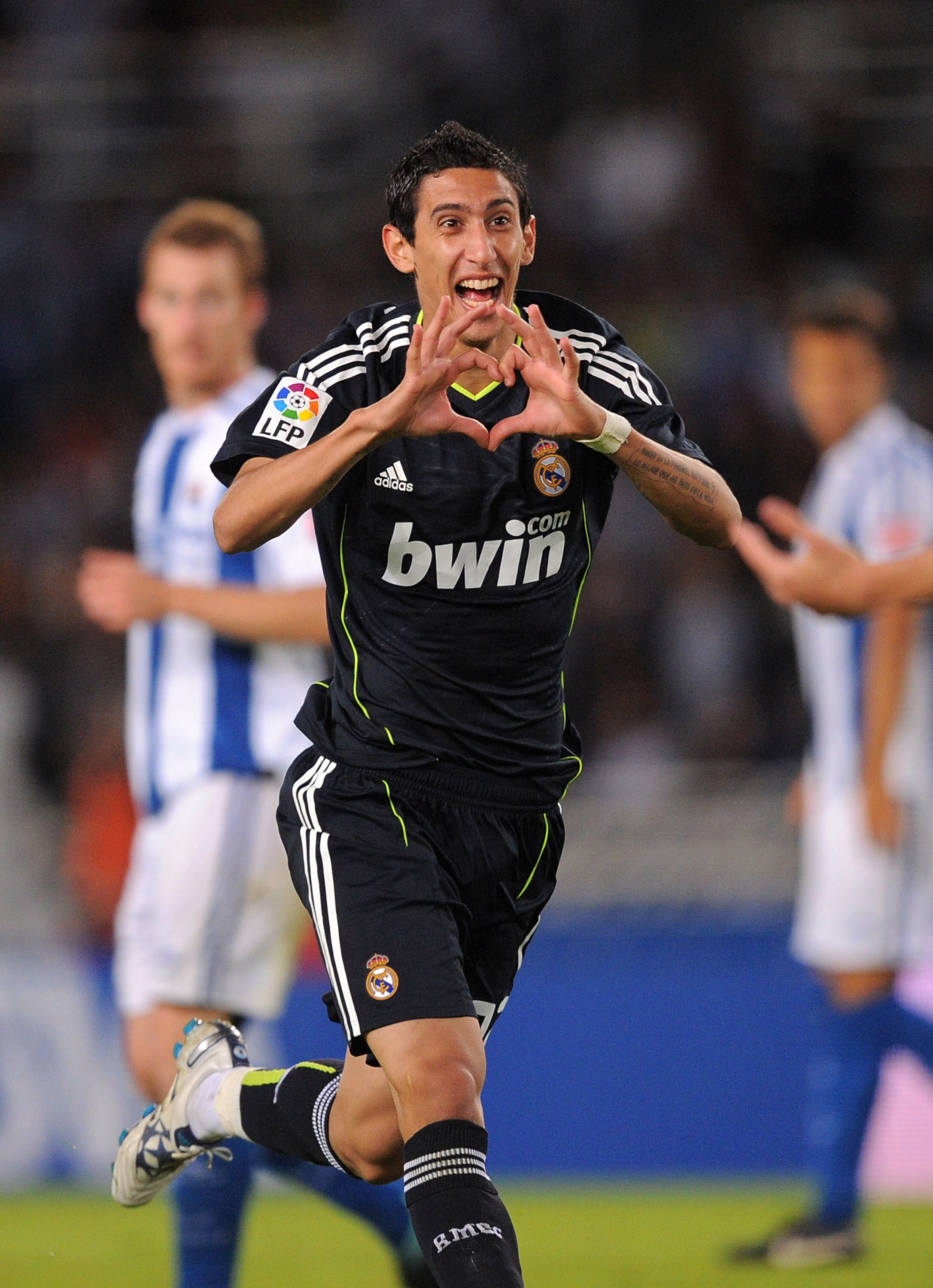 SAN SEBASTIAN, SPAIN - SEPTEMBER 18:  Angel di Maria of Real Madrid celebrates after scoring Real's first goal during the La Liga match between Real Sociedad and Real Madrid at Estadio Anoeta on September 18, 2010 in San Sebastian, Spain.  (Photo by Denis