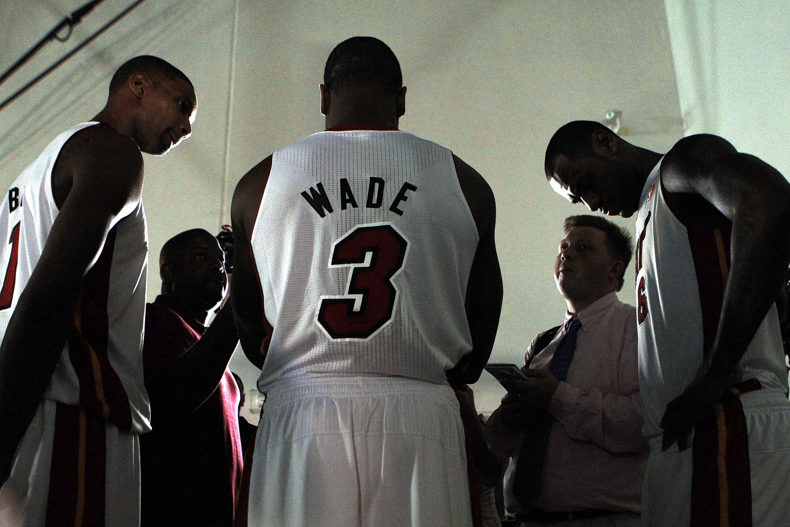 MIAMI - SEPTEMBER 27: Dwyane Wade (C) of the Miami Heat is flanked by teammates Chris Bosh (L) and LeBron James (R) as they answer questions during media day at the Bank United Center on September 27, 2010 in Miami, Florida. NOTE TO USER: User expressly MIAMI - SEPTEMBER 27: Dwyane Wade (C) of the Miami Heat is flanked by teammates Chris Bosh (L) and LeBron James (R) as they answer questions during media day at the Bank United Center on September 27, 2010 in Miami, Florida. NOTE TO USER: User expressly