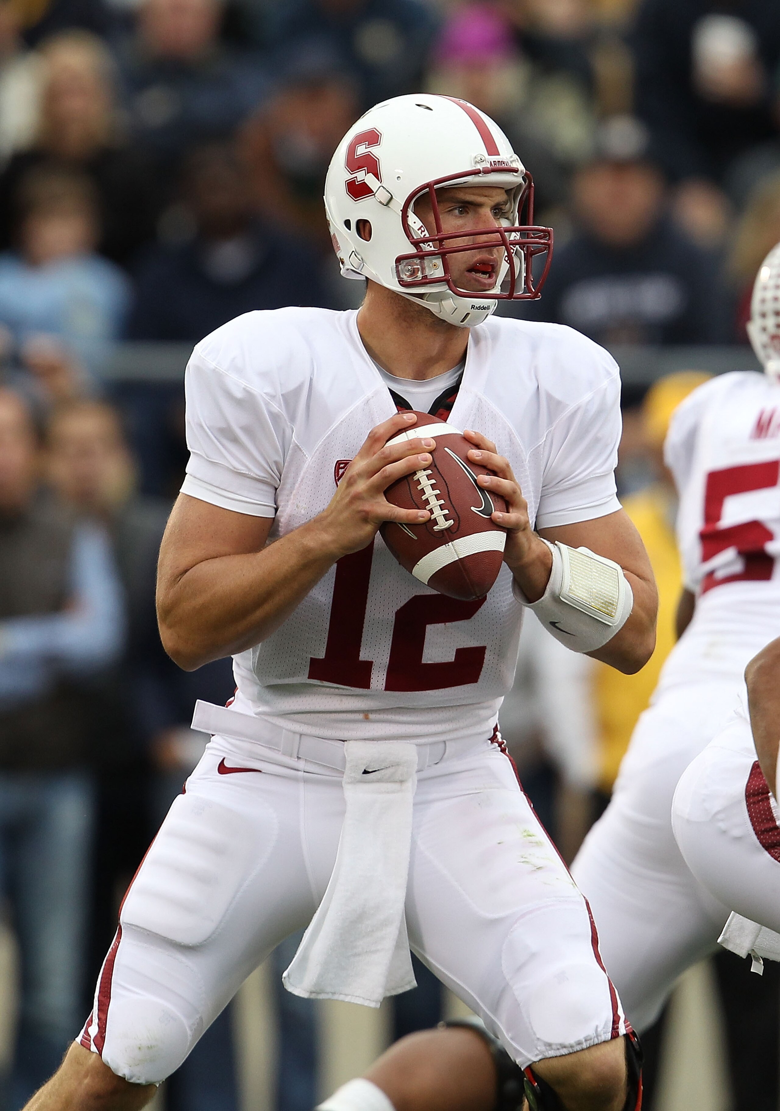 SOUTH BEND, IN - SEPTEMBER 25: Andrew Luck #12 of the Stanford Cardinal looks for a receiver against the Notre Dame Fighting Irish at Notre Dame Stadium on September 25, 2010 in South Bend, Indiana. Stanford defeated Notre Dame 37-14. (Photo by Jonathan D