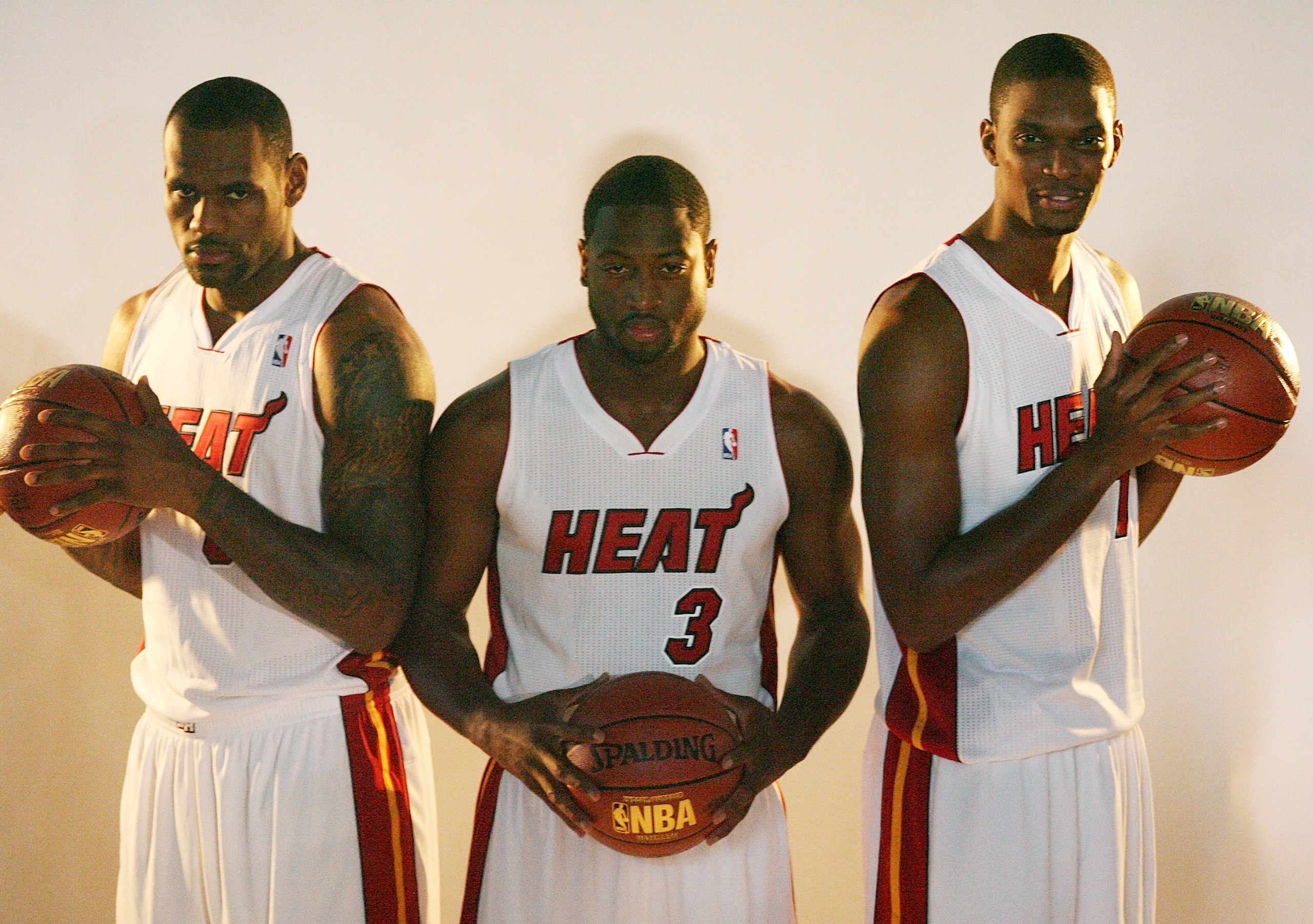 MIAMI - SEPTEMBER 27: (L-R) LeBron James, Dwyane Wade and Chris Bosh of the Miami Heat pose for photos during media day at the Bank United Center on September 27, 2010 in Miami, Florida. (Photo by Marc Serota/Getty Images) MIAMI - SEPTEMBER 27: (L-R) LeBron James, Dwyane Wade and Chris Bosh of the Miami Heat pose for photos during media day at the Bank United Center on September 27, 2010 in Miami, Florida. (Photo by Marc Serota/Getty Images)