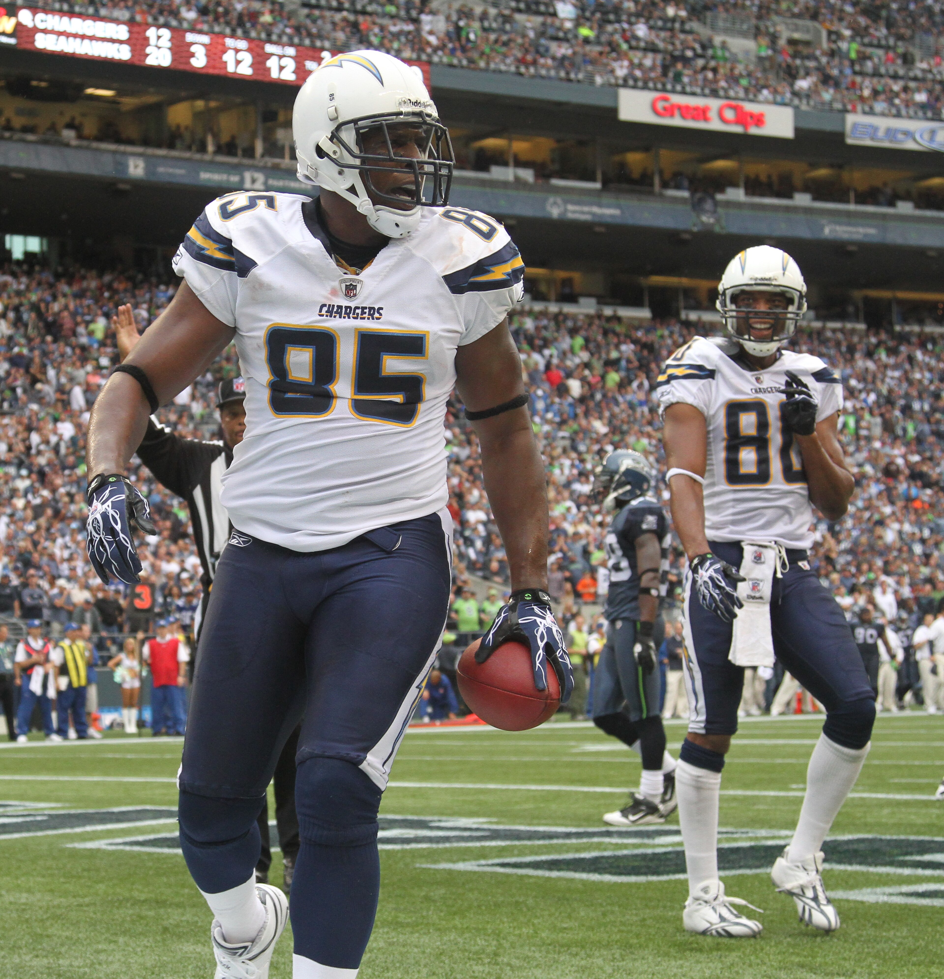 SEATTLE - SEPTEMBER 26:  Tight end Antonio Gates #85 of the San Diego Chargers celebrates with Malcom Floyd #80 after scoring a touchdown against the Seattle Seahawks at Qwest Field on September 26, 2010 in Seattle, Washington. (Photo by Otto Greule Jr/Ge