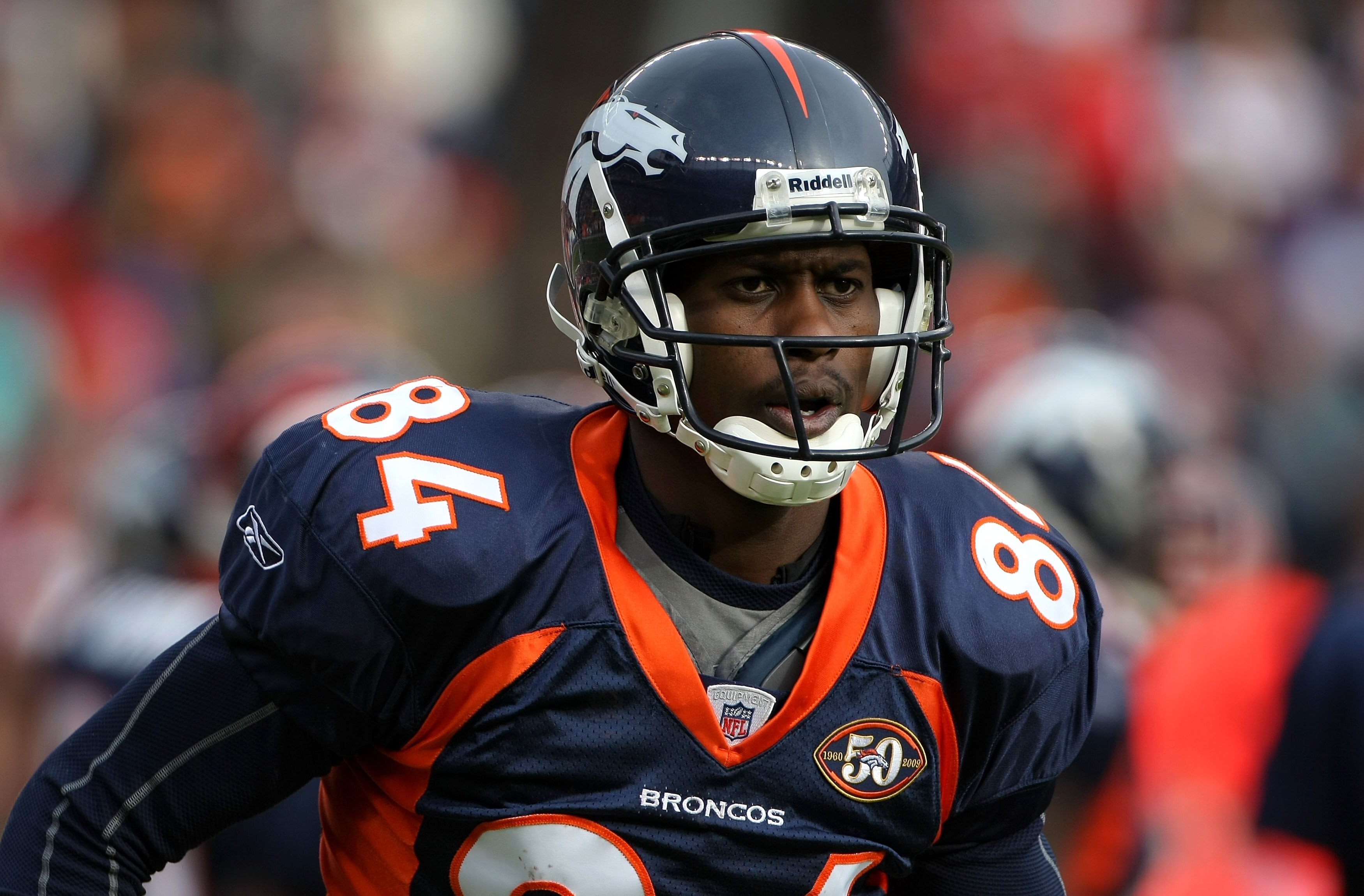 DENVER - JANUARY 03:  Brandon Lloyd #84 of the Denver Broncos heads for the sidelines against the Kansas City Chiefs during NFL action at Invesco Field at Mile High on January 3, 2010 in Denver, Colorado. The Chiefs defeated the Broncos 44-24.  (Photo by 