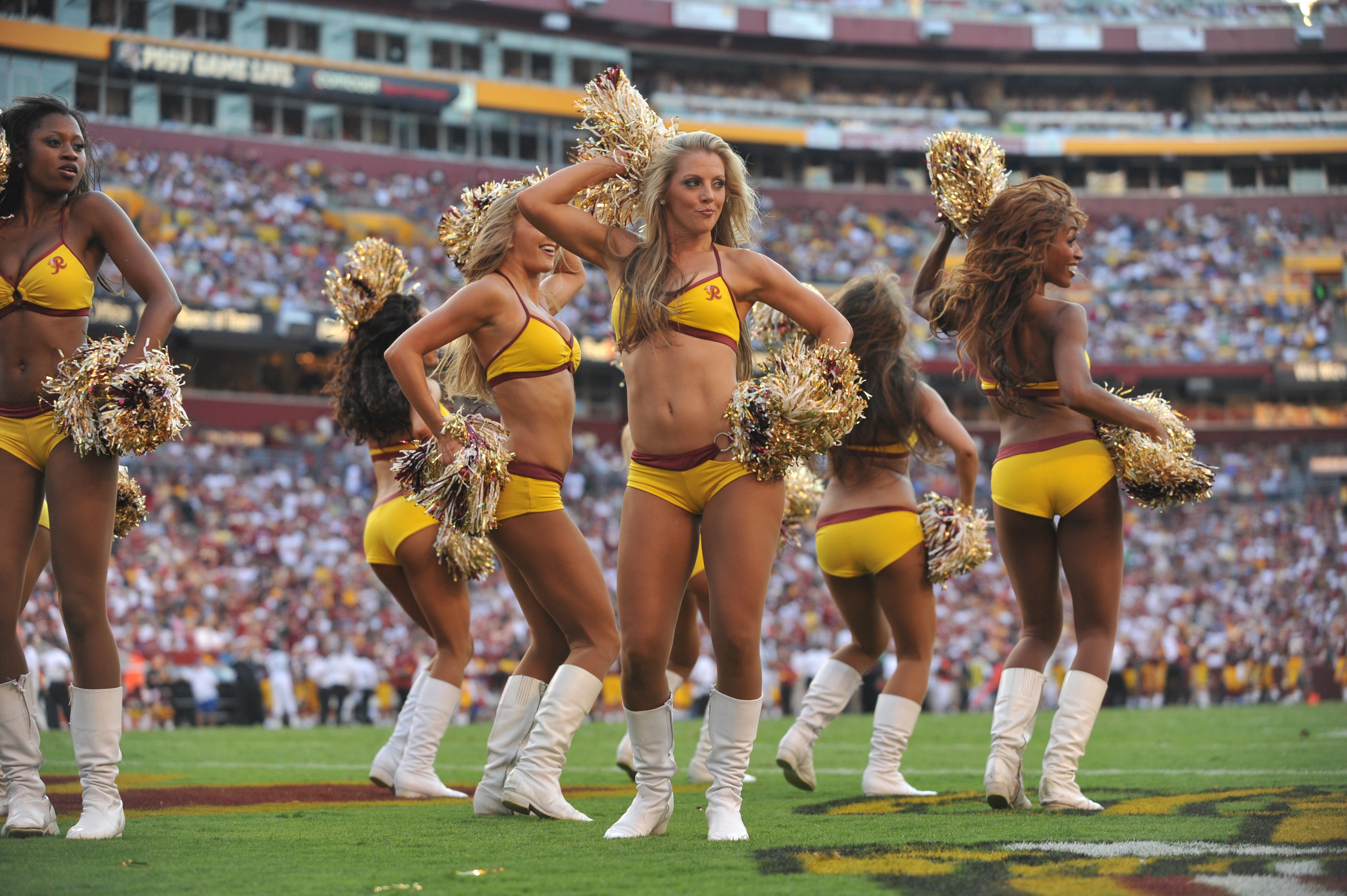 LANDOVER, MD - SEPTEMBER 19:  Cheerleaders for the Washington Redskins cheer during the game against the Houston Texans at FedExField on September 19, 2010 in Landover, Maryland. The Texans defeated the Redskins in overtime 30-27. (Photo by Larry French/G