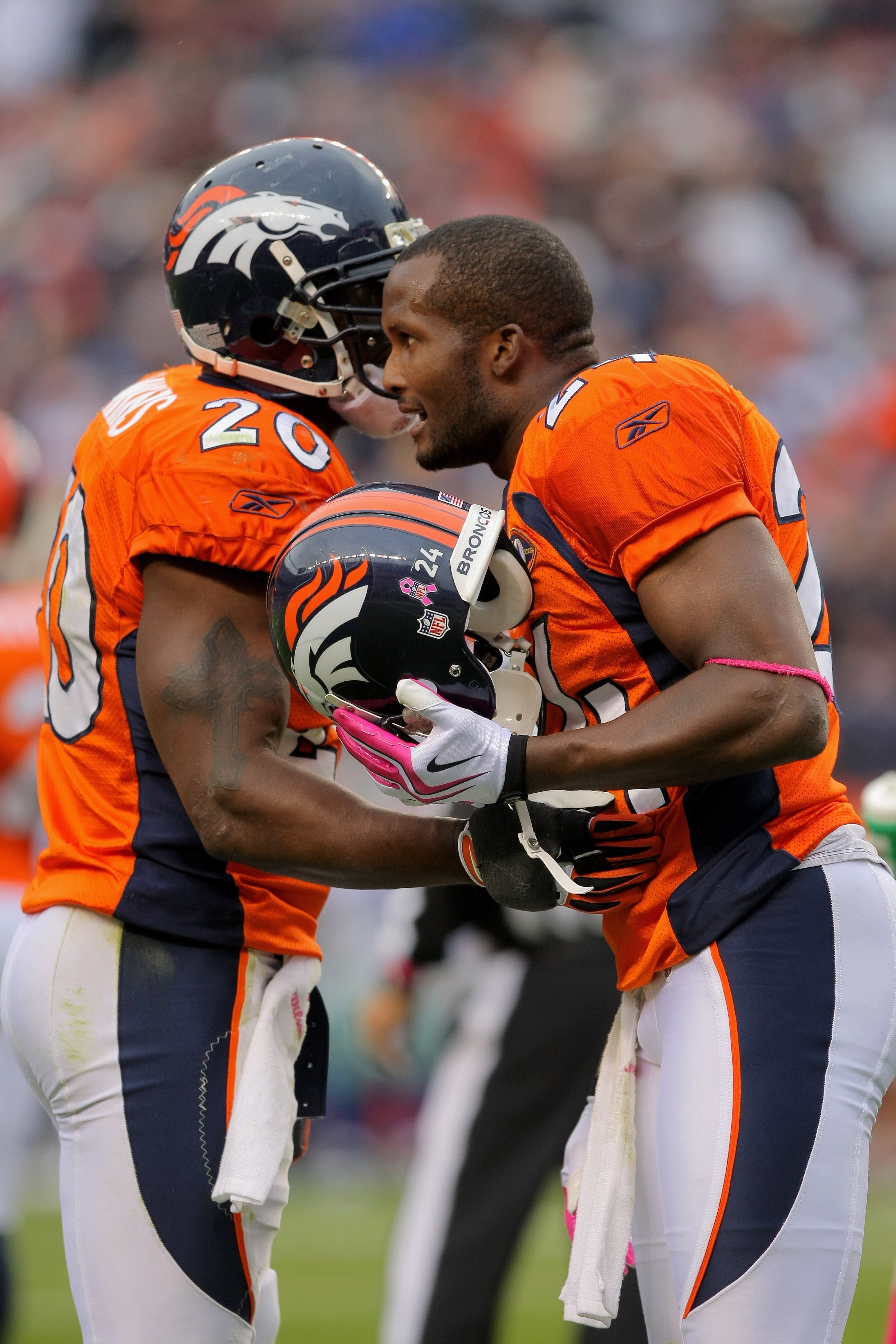 DENVER - OCTOBER 04:  Defensive backs Brian Dawkins #20 and Champ Bailey #24 of the Denver Broncos converse during the final drive by the Dallas Cowboys during NFL action at Invesco Field at Mile High on October 4, 2009 in Denver, Colorado. The Broncos de