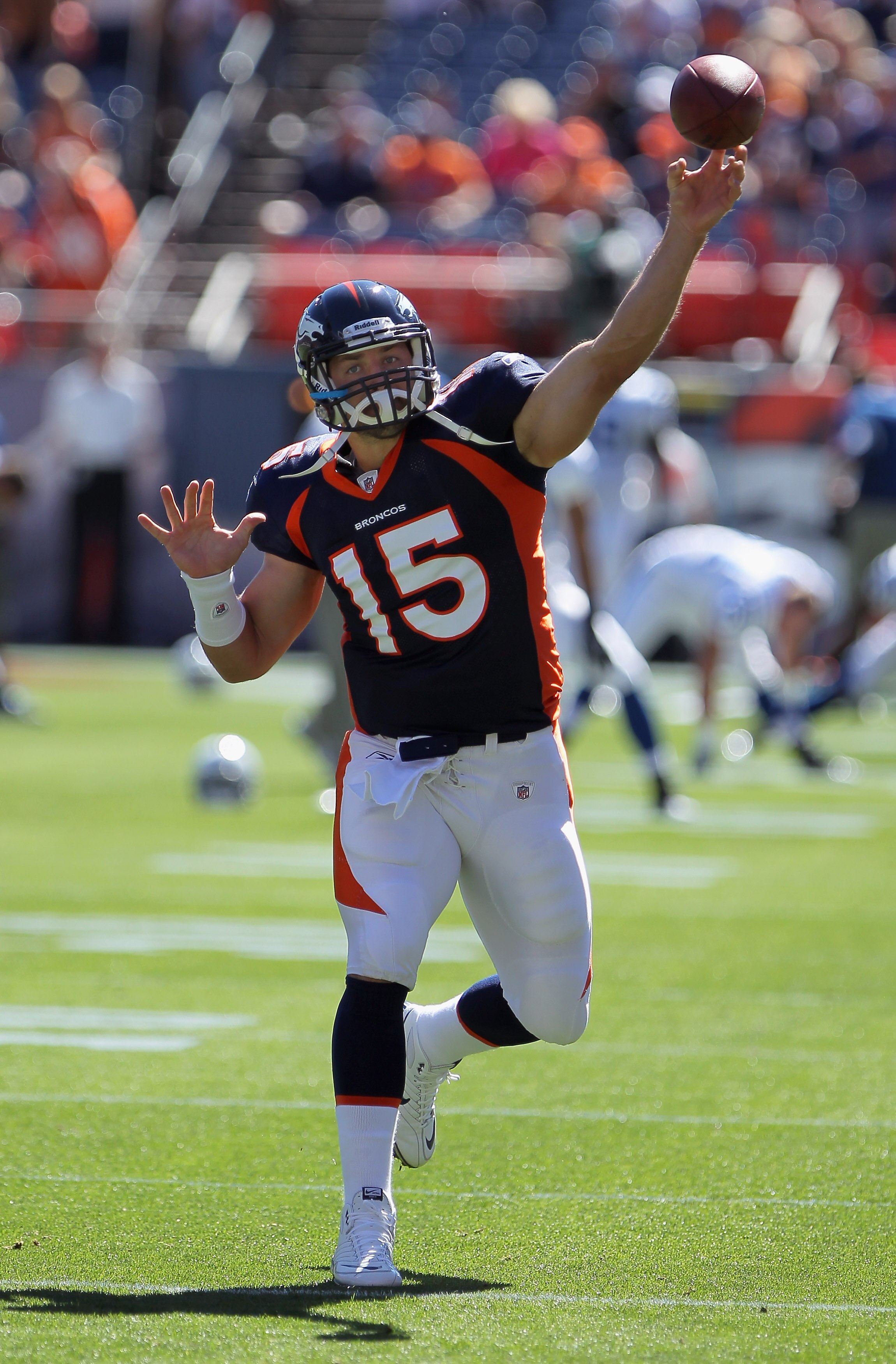 DENVER - SEPTEMBER 26:  Quarterback Tim Tebow #15 of the Denver Broncos warms up prior to facing the Indianapolis Colts at INVESCO Field at Mile High on September 26, 2010 in Denver, Colorado. The Colts defeated the Broncos 27-13.  (Photo by Doug Pensinge