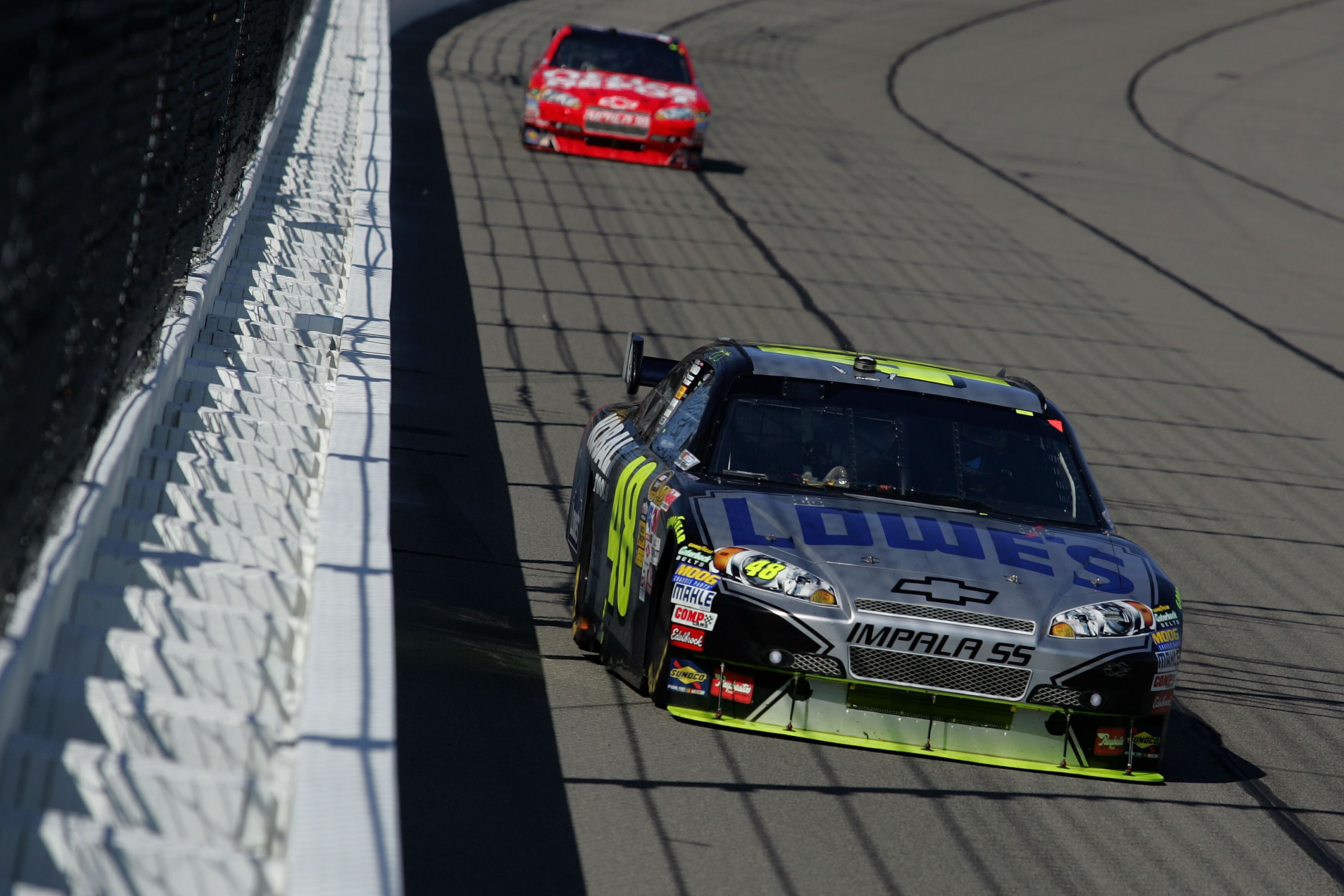 KANSAS CITY, KS - OCTOBER 04:  Jimmie Johnson, driver of the Lowe's / KOBALT Tools Chevrolet, leads Tony Stewart, driver of the #14 Office Depot / Old Spice Chevrolet during the NASCAR Sprint Cup Series Price Chopper 400 presented by Kraft Foods at the Ka