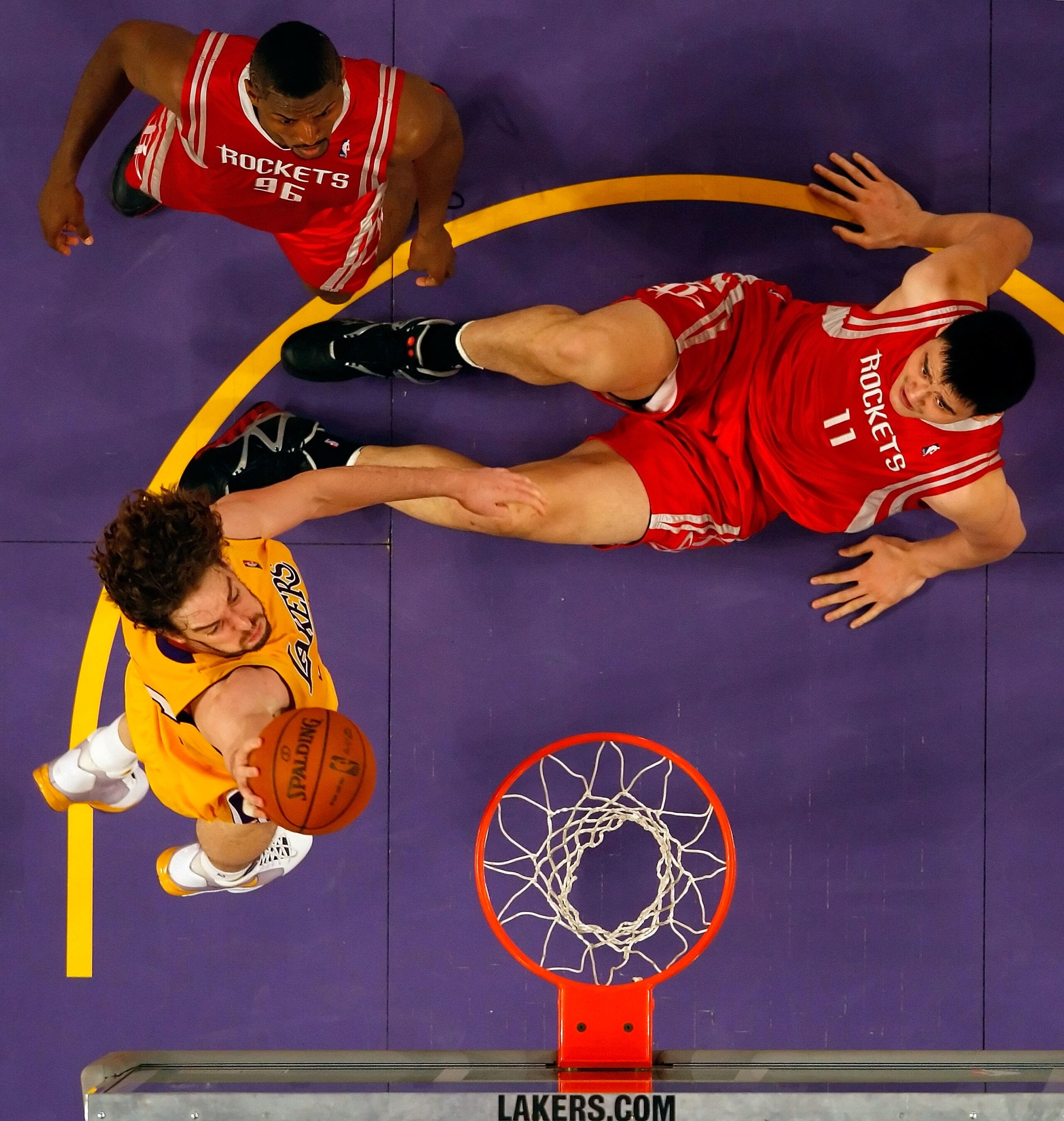 LOS ANGELES, CA - MAY 04: Pau Gasol #16 of the Los Angeles Lakers goes up for a shot as Yao Ming #11 and Ron Artest #96 of the Houston Rockets look on in Game One of the Western Conference Semifinals during the 2009 NBA Playoffs at Staples Center on May LOS ANGELES, CA - MAY 04: Pau Gasol #16 of the Los Angeles Lakers goes up for a shot as Yao Ming #11 and Ron Artest #96 of the Houston Rockets look on in Game One of the Western Conference Semifinals during the 2009 NBA Playoffs at Staples Center on May