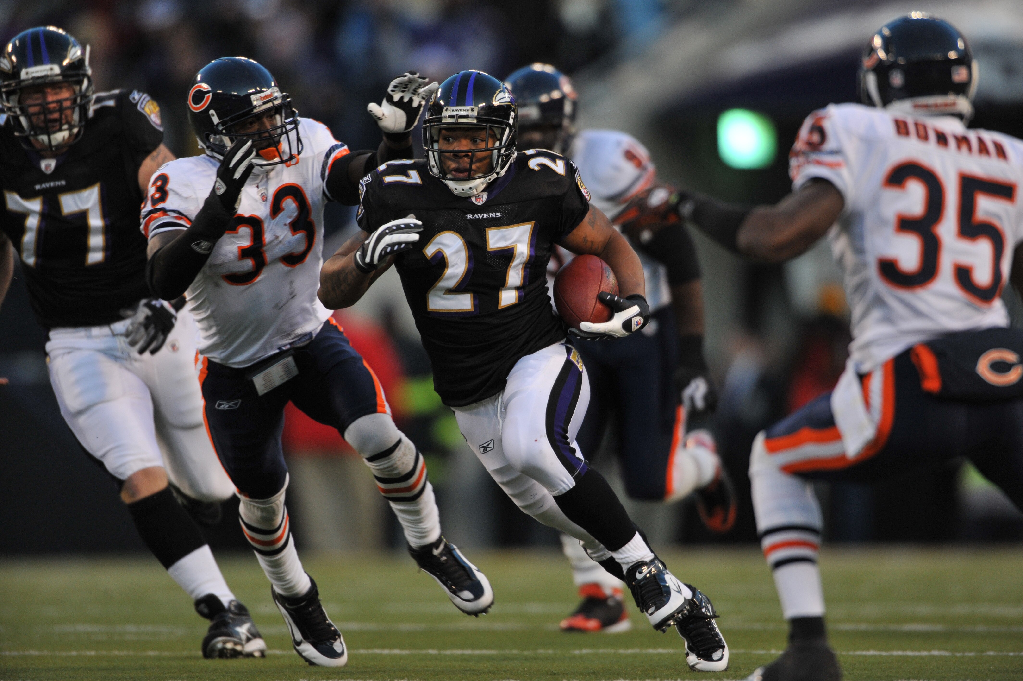 BALTIMORE - DECEMBER 20:  Ray Rice #27 of the Baltimore Ravens runs the ball against the Chicago Bears at M&T Bank Stadium on December 20, 2009 in Baltimore, Maryland. (Photo by Larry French/Getty Images)