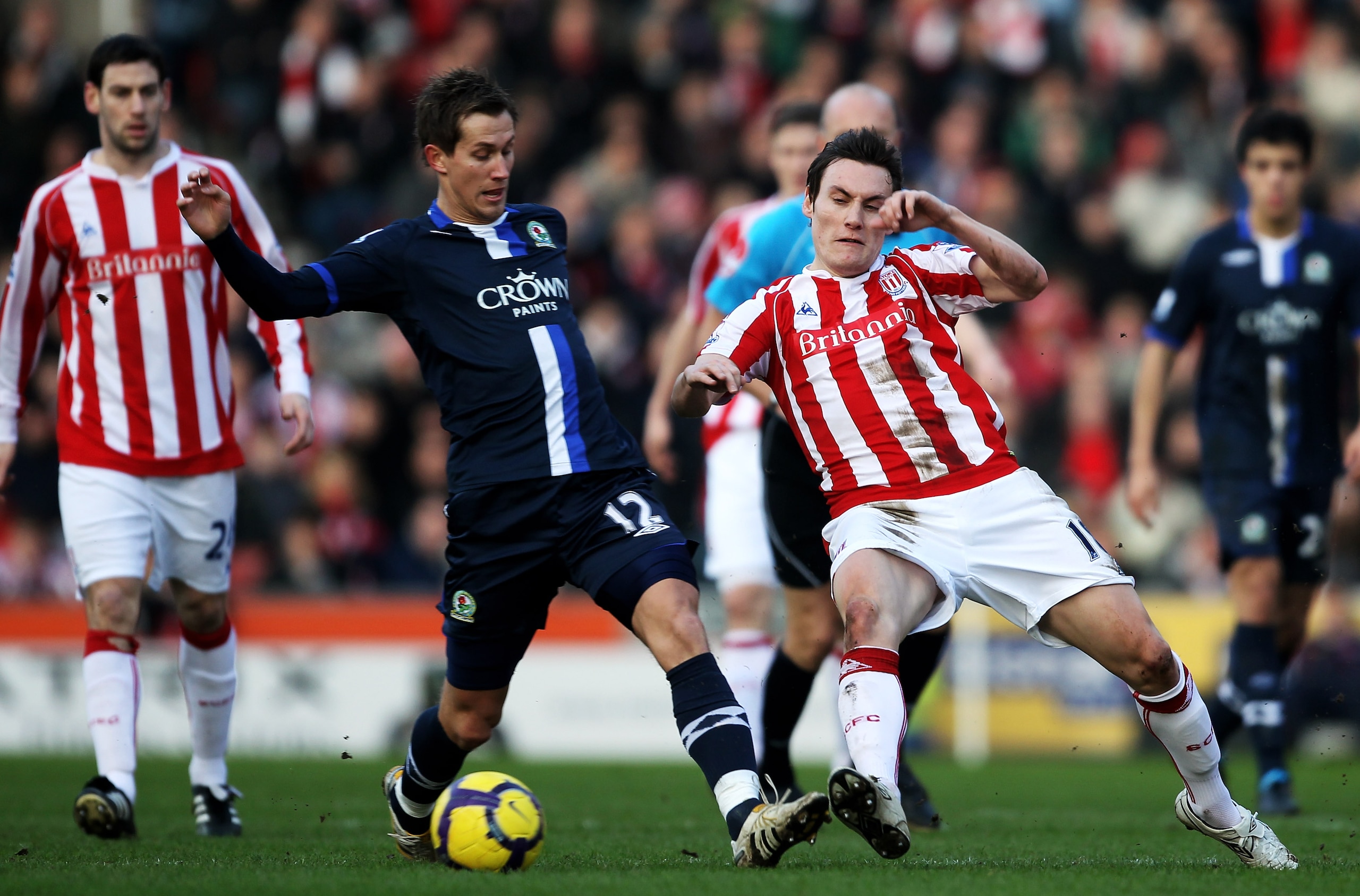 STOKE ON TRENT, ENGLAND - FEBRUARY 06: Morten Gamst Pedersen of Blackburn Rovers holds off a challenge from Dean Whitehead of Stoke City during the Barclays Premier League match between Stoke City and Blackburn Rovers at Britannia Stadium on February 6, STOKE ON TRENT, ENGLAND - FEBRUARY 06: Morten Gamst Pedersen of Blackburn Rovers holds off a challenge from Dean Whitehead of Stoke City during the Barclays Premier League match between Stoke City and Blackburn Rovers at Britannia Stadium on February 6,