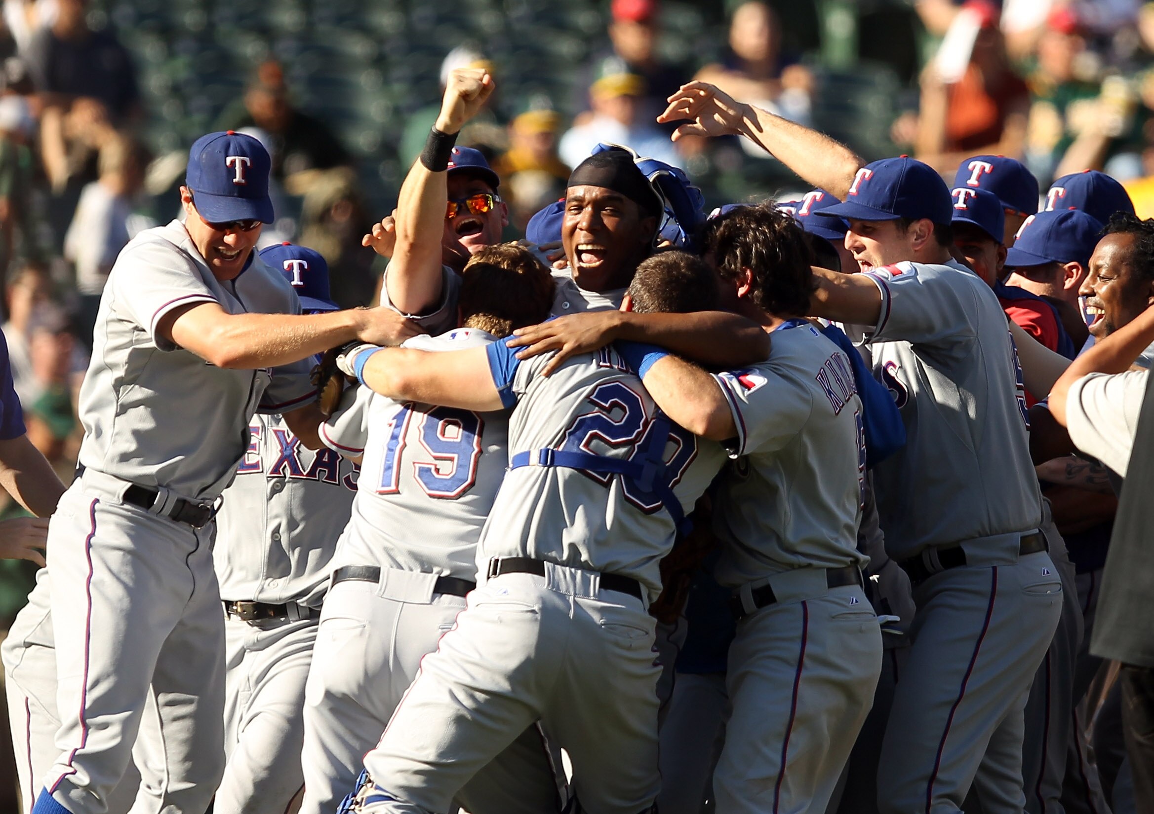 OAKLAND, CA - SEPTEMBER 25:  The Texas Rangers celebrate after they beat the Oakland Athletics to clinch the American League West Title at the Oakland-Alameda County Coliseum on September 25, 2010 in Oakland, California.  (Photo by Ezra Shaw/Getty Images)