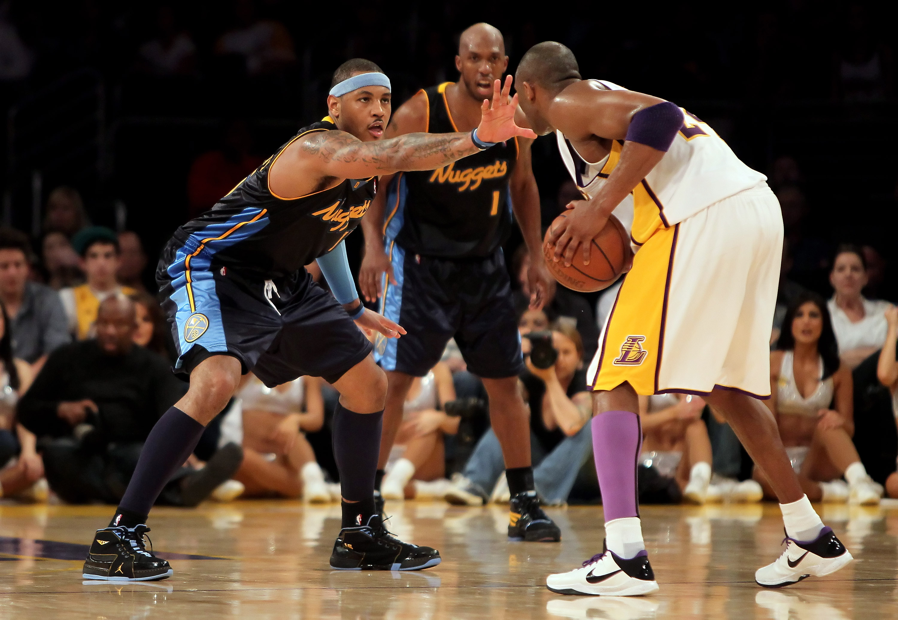 LOS ANGELES, CA - FEBRUARY 28:  Kobe Bryant #24 of the Los Angeles Lakers is defended by Carmelo Anthony #15 of the Denver Nuggets during the second half at Staples Center on February 28, 2010 in Los Angeles, California. The Lakers defeated the Nuggets 95