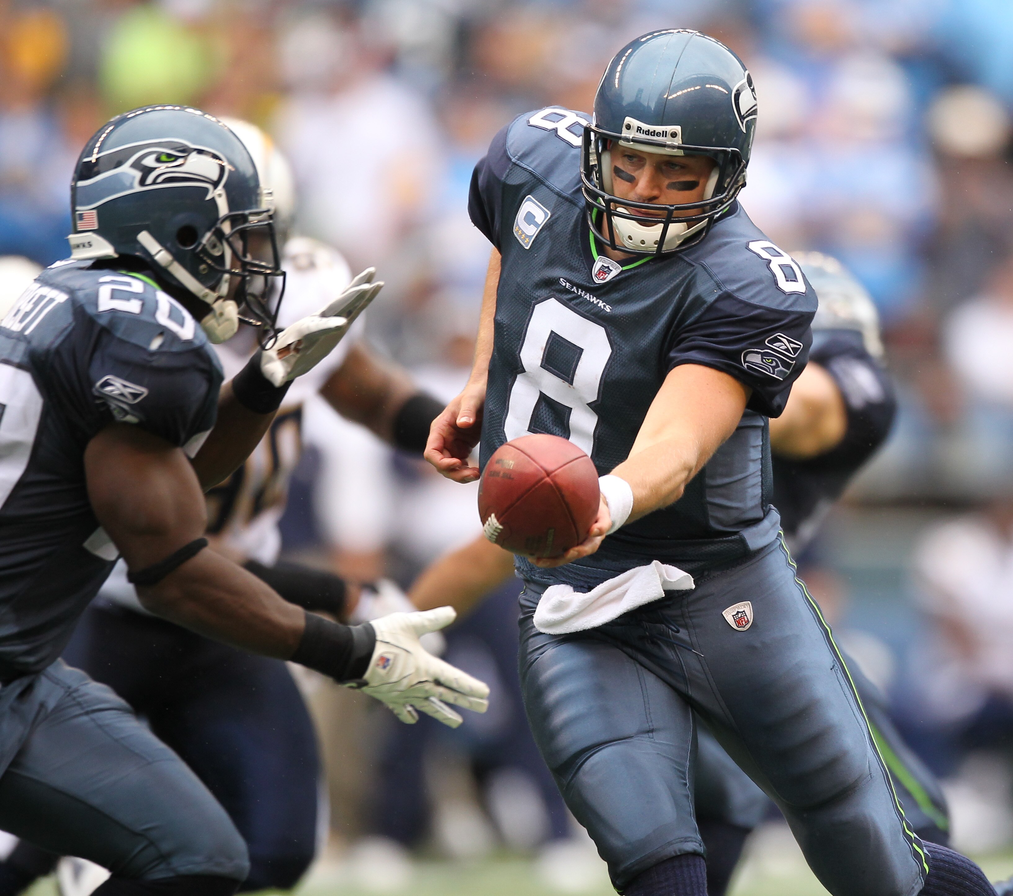 SEATTLE - SEPTEMBER 26:  Quarterback Matt Hasselbeck #8 of the Seattle Seahawks hands off to Justin Forsett #20 against the San Diego Chargers at Qwest Field on September 26, 2010 in Seattle, Washington. (Photo by Otto Greule Jr/Getty Images)