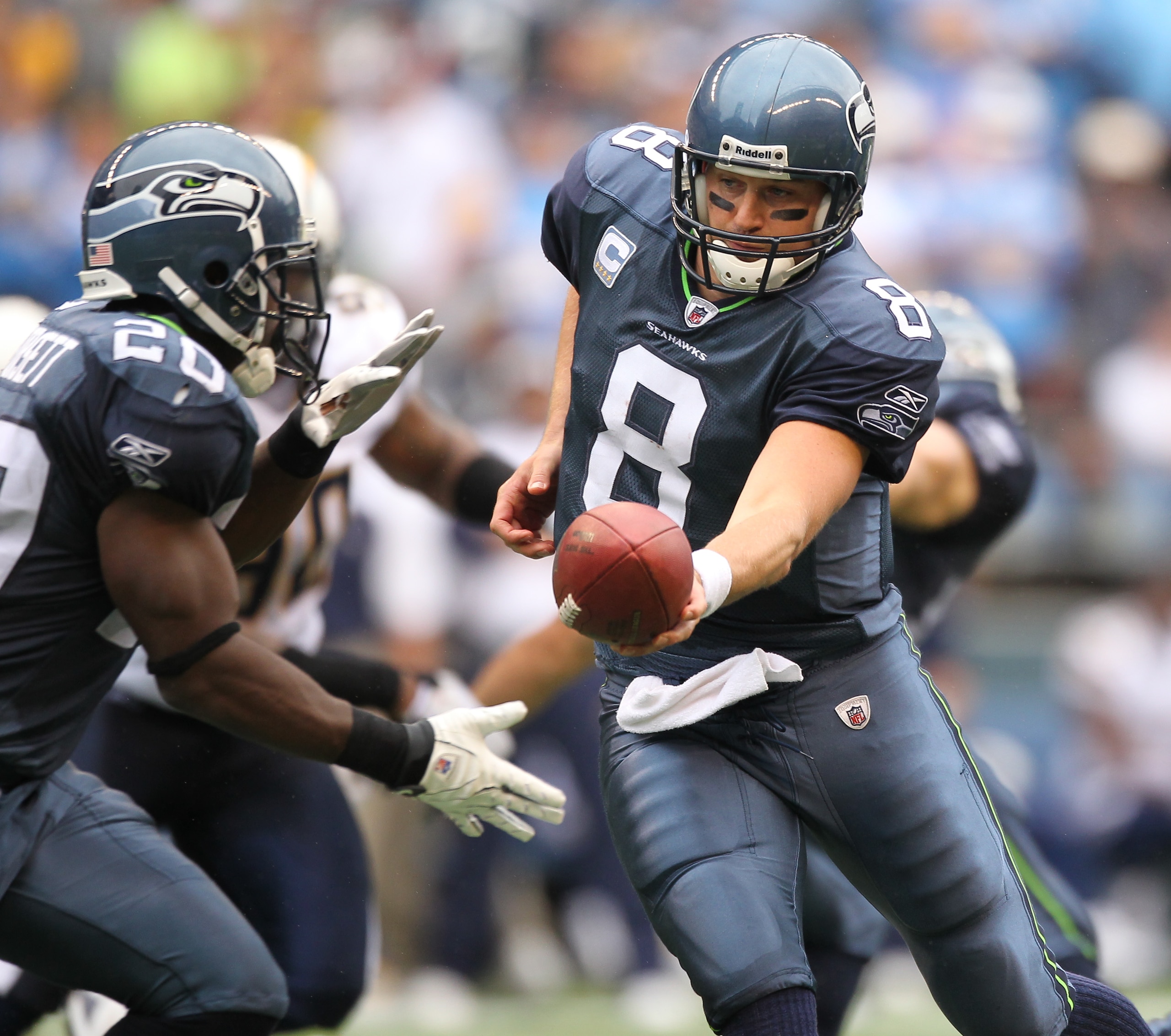 SEATTLE - SEPTEMBER 26:  Quarterback Matt Hasselbeck #8 of the Seattle Seahawks hands off to Justin Forsett #20 against the San Diego Chargers at Qwest Field on September 26, 2010 in Seattle, Washington. (Photo by Otto Greule Jr/Getty Images)