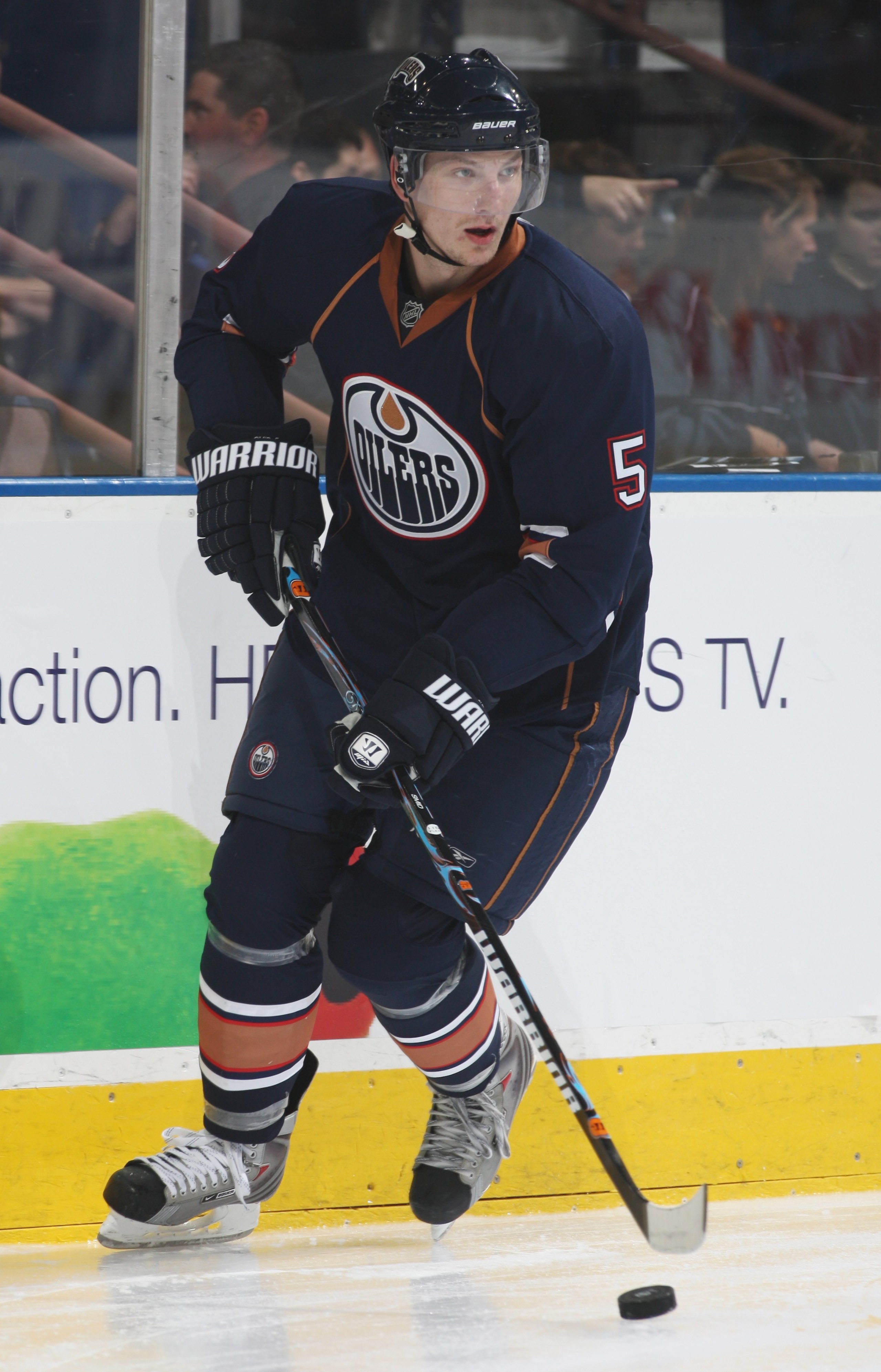 EDMONTON, CANADA - SEPTEMBER 16:  Ladislav Smid #5 of the Edmonton Oilers skates with the puck against the New York Islanders on September 16, 2009 at Rexall Place in Edmonton, Alberta, Canada. The Oilers won 3-2. (Photo by Dale MacMillan/Getty Images)
