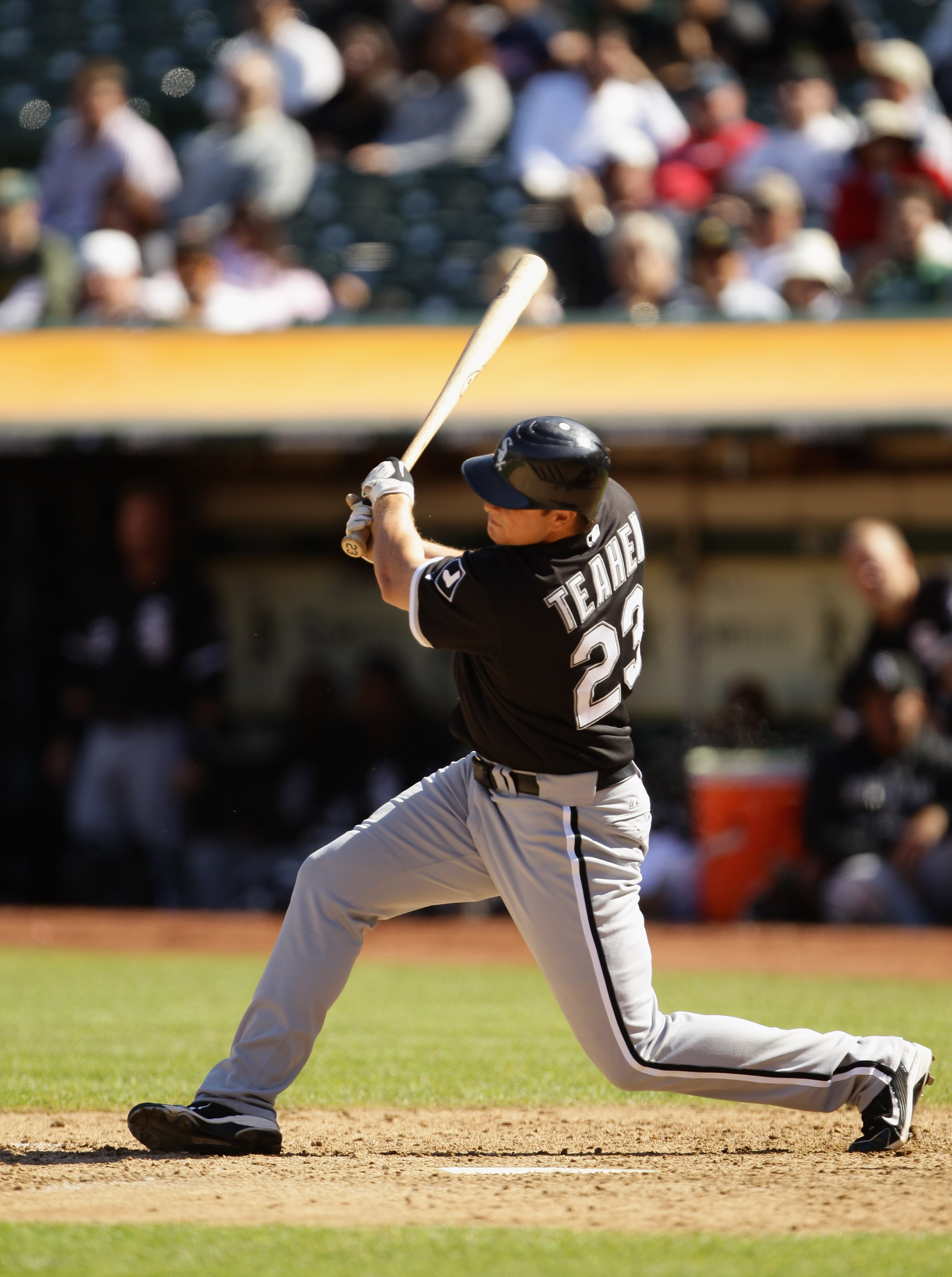 OAKLAND, CA - SEPTEMBER 22:  Mark Teahen #23 of the Chicago White Sox hits a double to score Gordon Beckham #15 in the ninth inning to give the White Sox a 4-3 over the Oakland Athletics at the Oakland-Alameda County Coliseum on September 22, 2010 in Oakl
