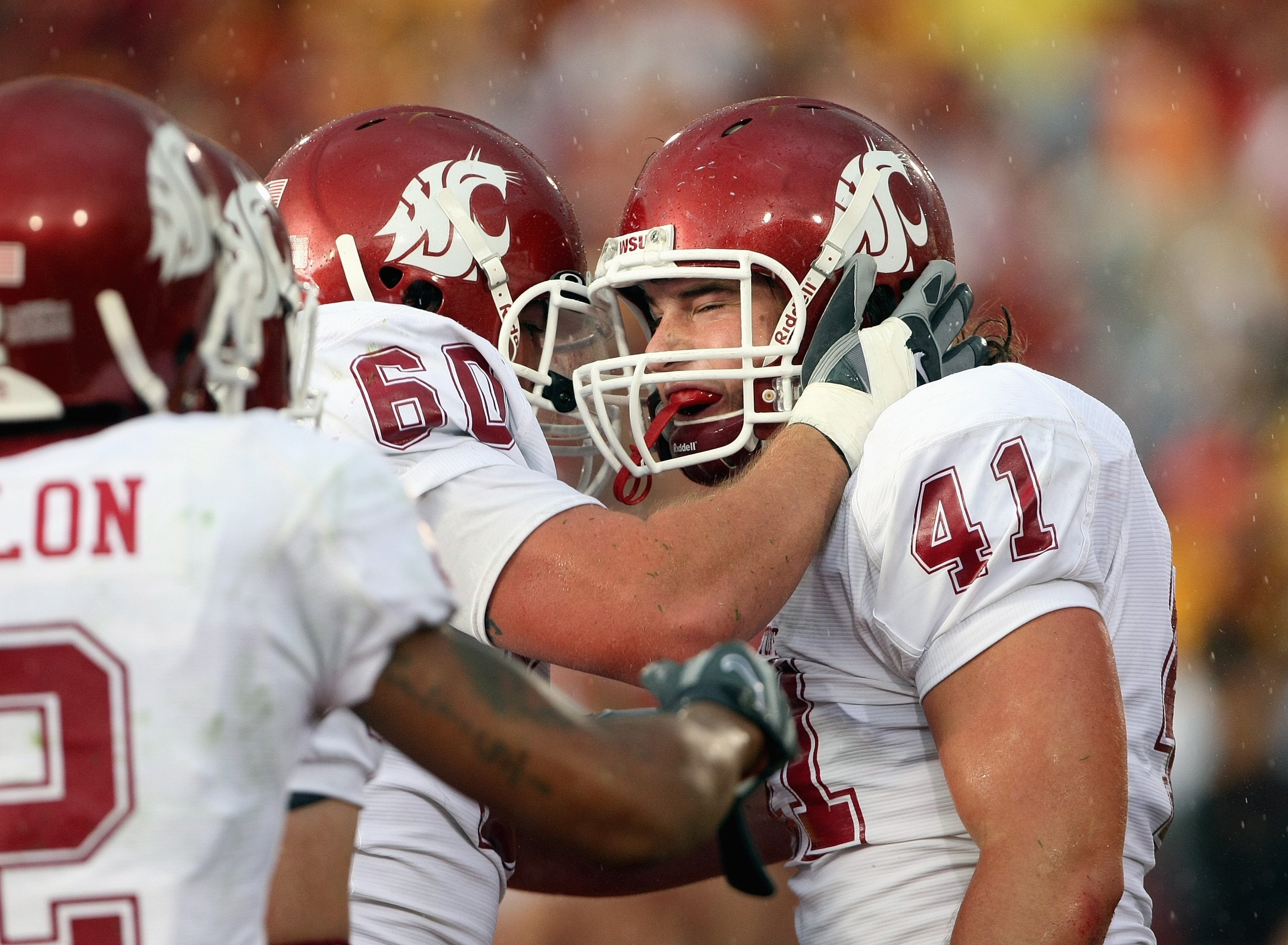 LOS ANGELES - SEPTEMBER 22:  Jed Collins #41 of the Washington State Cougars is congratulated during the game against the USC Trojans on September 22, 2007 at the Los Angeles Coliseum in Los Angeles, California.  (Photo by Stephen Dunn/Getty Images)