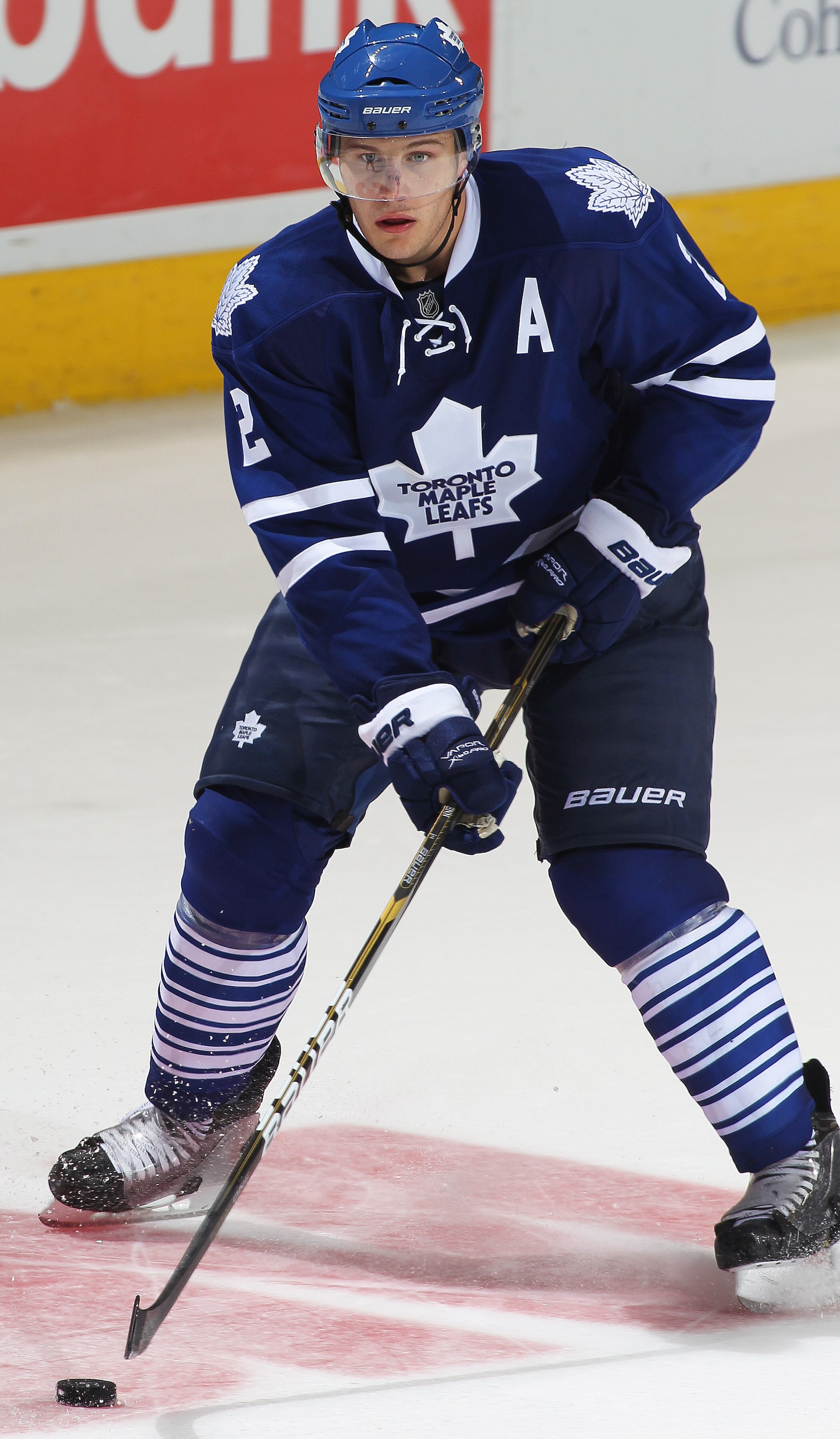 LONDON,ON - SEPTEMBER 23: Luke Schenn #2 of the Toronto Maple Leafs skates with the puck in a pre-season game against the Philadelphia Flyers on September 23,2010 at the John Labatt Centre in London, Ontario. The Leafs defeated the Flyers 3-2 in a shoot-o