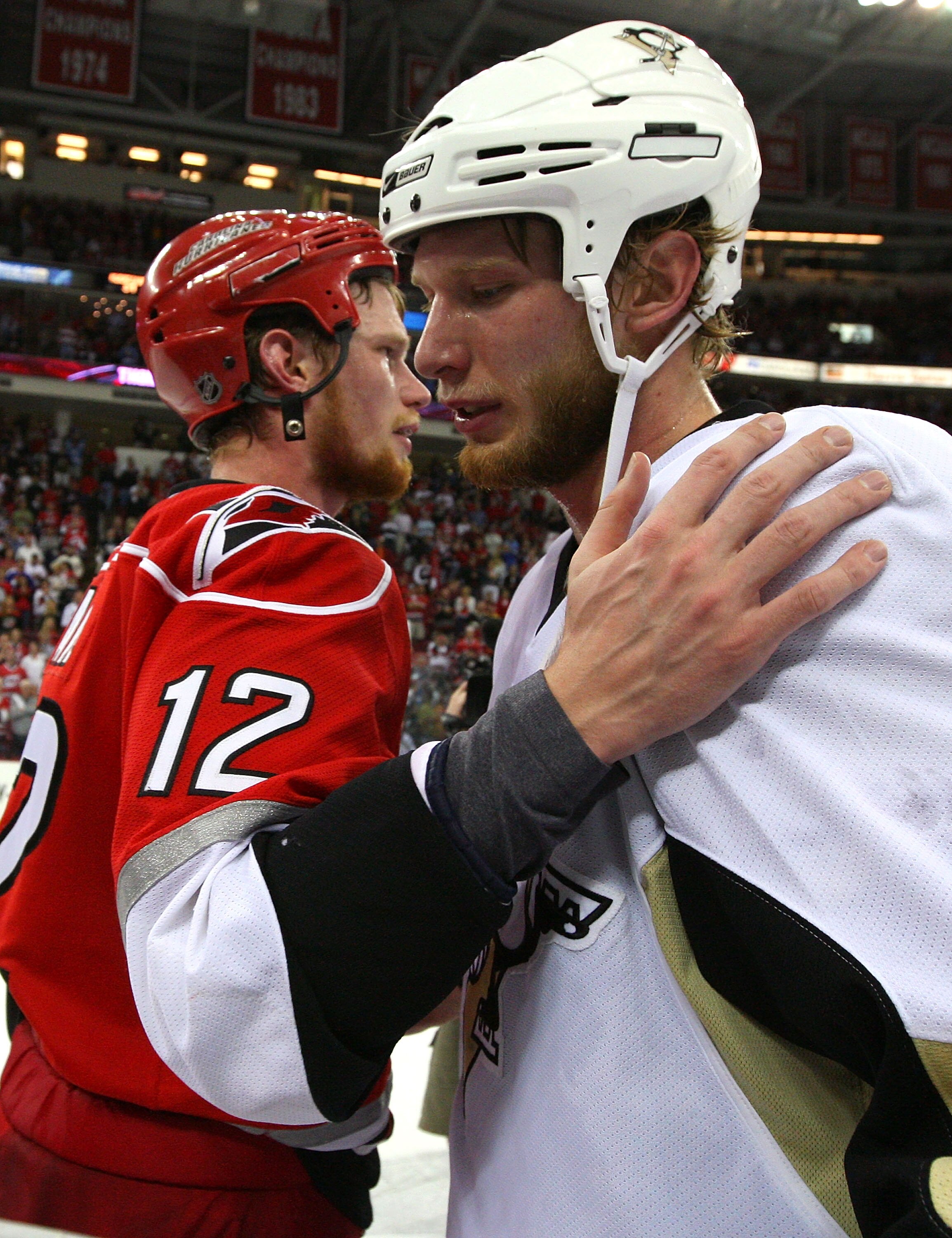 RALEIGH, NC - MAY 26:  Jordan Staal #12 of the Pittsburgh Penguins is congratulated by his brother Eric Staal #12 of the Carolina Hurricanes after the Penguins 4-1 win in Game Four of the Eastern Conference Championship Round of the 2009 Stanley Cup Playo