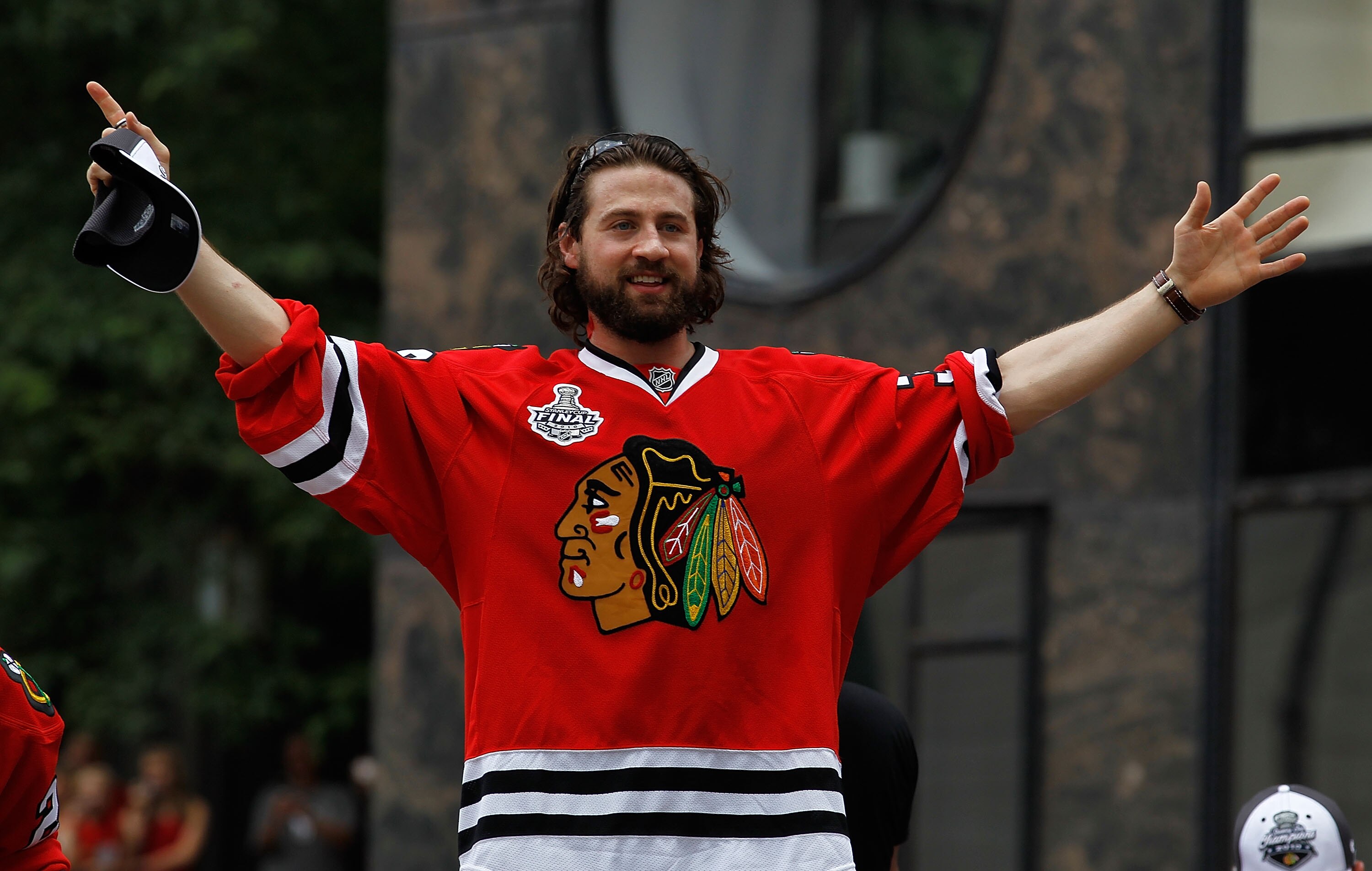 CHICAGO - JUNE 11: Adam Burish #37 waves to fans during the Chicago Blackhawks Stanley Cup victory parade and rally on June 11, 2010 in Chicago, Illinois. (Photo by Jonathan Daniel/Getty Images)