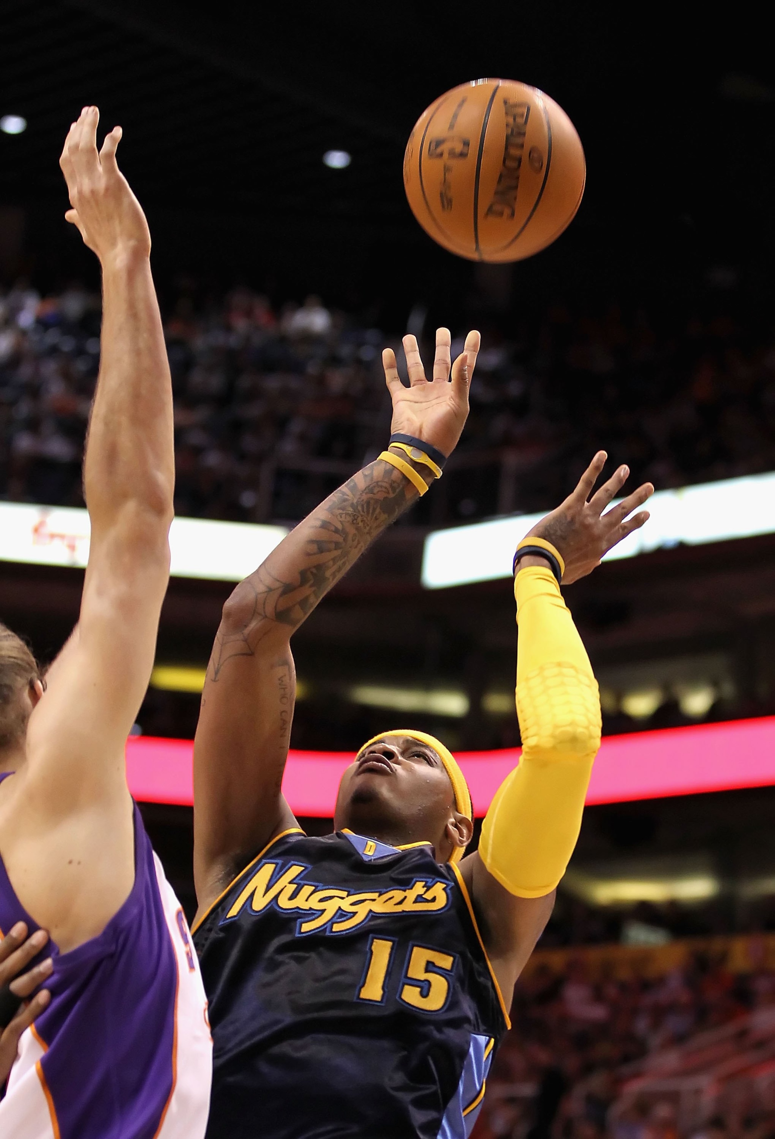 PHOENIX - APRIL 13:  Carmelo Anthony #15 of the Denver Nuggets puts up a shot during the NBA game against the Phoenix Suns at US Airways Center on April 13, 2010 in Phoenix, Arizona. The Suns defeated the Nuggets 123-101.  NOTE TO USER: User expressly ack
