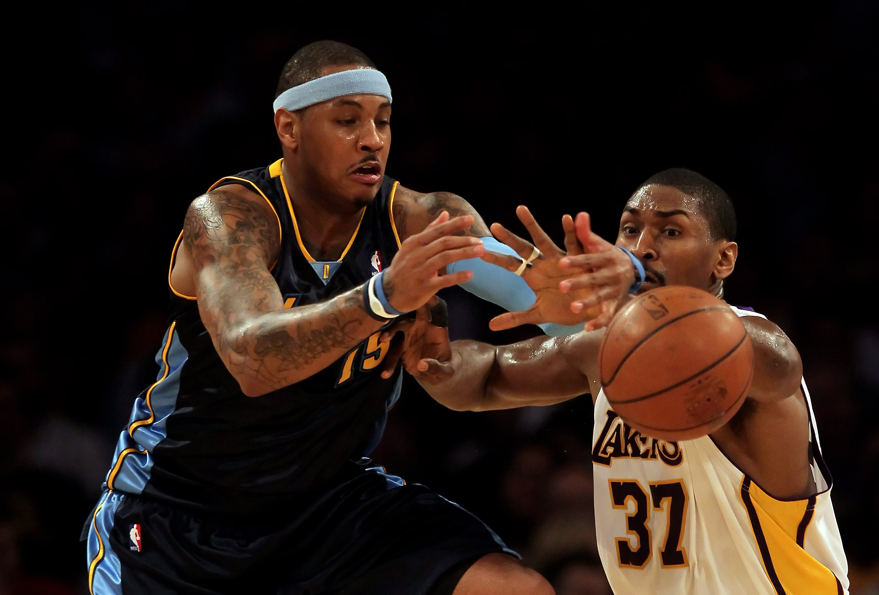 LOS ANGELES, CA - FEBRUARY 28:  Carmelo Anthony #15 of the Denver Nuggets has the ball knocked away by Ron Artest #37 of the Los Angeles Lakers during the first half at Staples Center on February 28, 2010 in Los Angeles, California.  NOTE TO USER: User ex