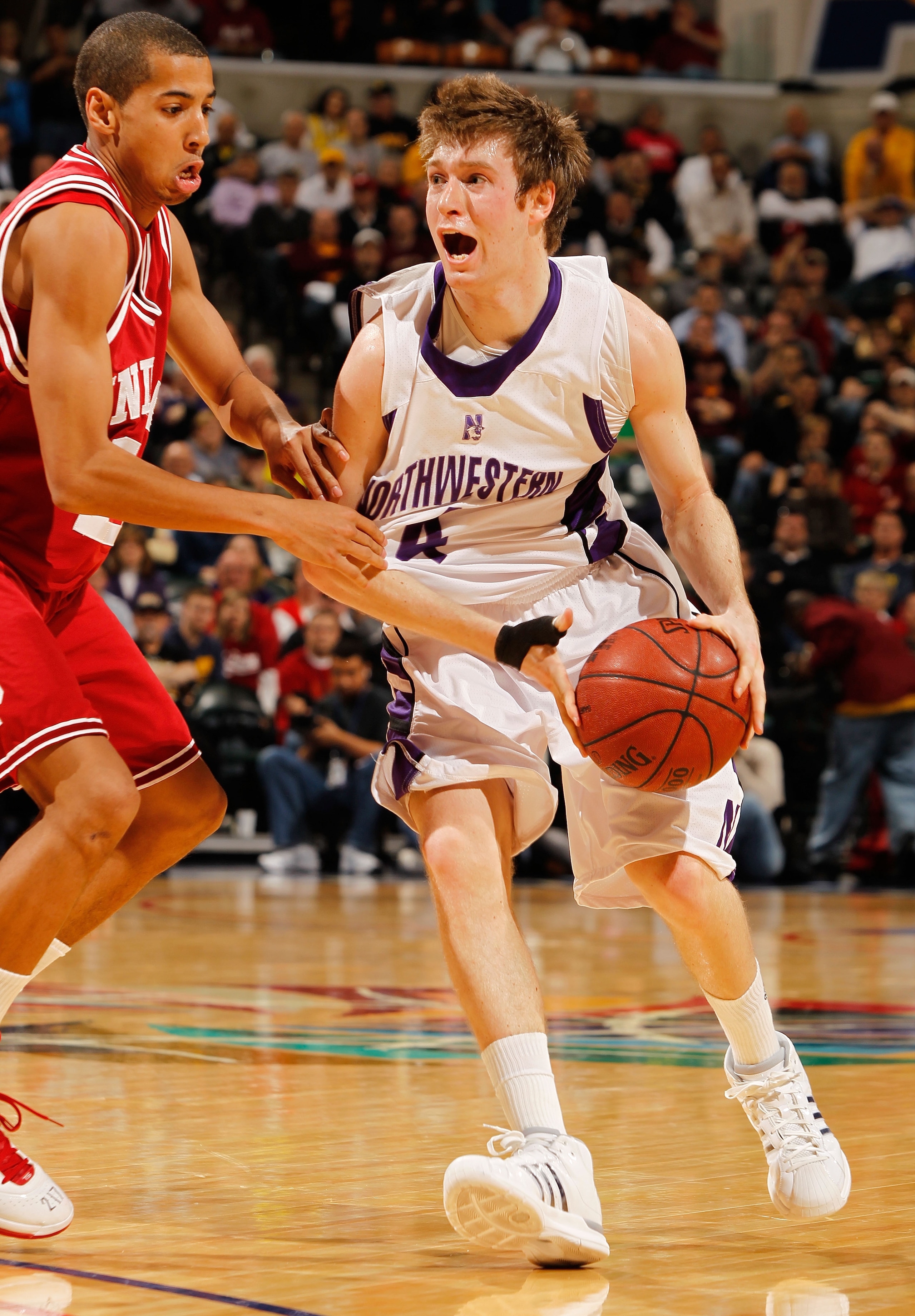 INDIANAPOLIS - MARCH 11:  Guard Alex Marcotullio #4 of the Northwestern Wildcats drives with the ball against the Indiana Hoosiers during the first round of the Big Ten Men's Basketball Tournament at Conseco Fieldhouse on March 11, 2010 in Indianapolis, I