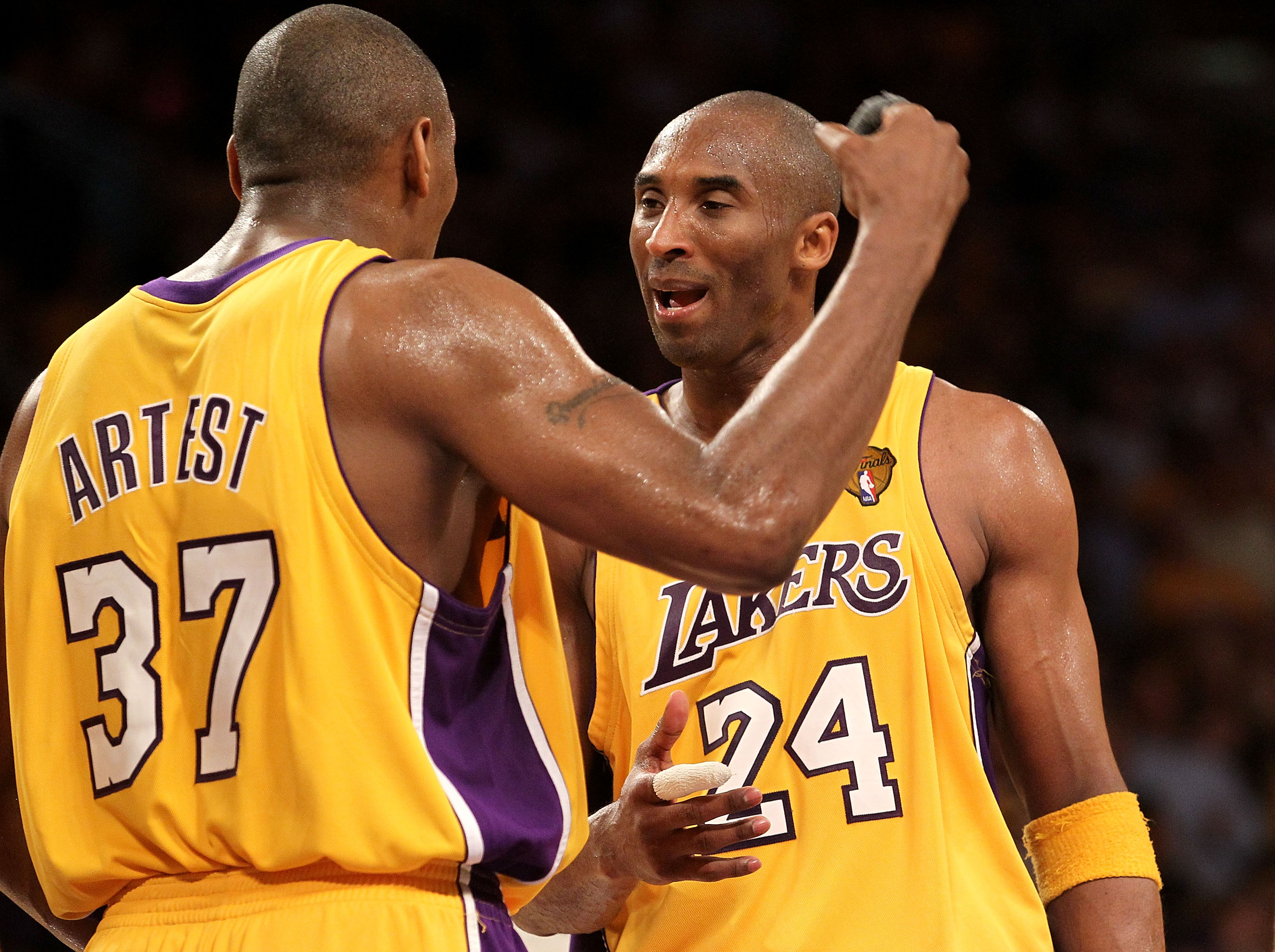 LOS ANGELES, CA - JUNE 03:  Ron Artest #37 and Kobe Bryant #24 of the Los Angeles Lakers celebrate near the end of their Game One win over the Boston Celtics of the 2010 NBA Finals at Staples Center on June 3, 2010 in Los Angeles, California.  NOTE TO USE