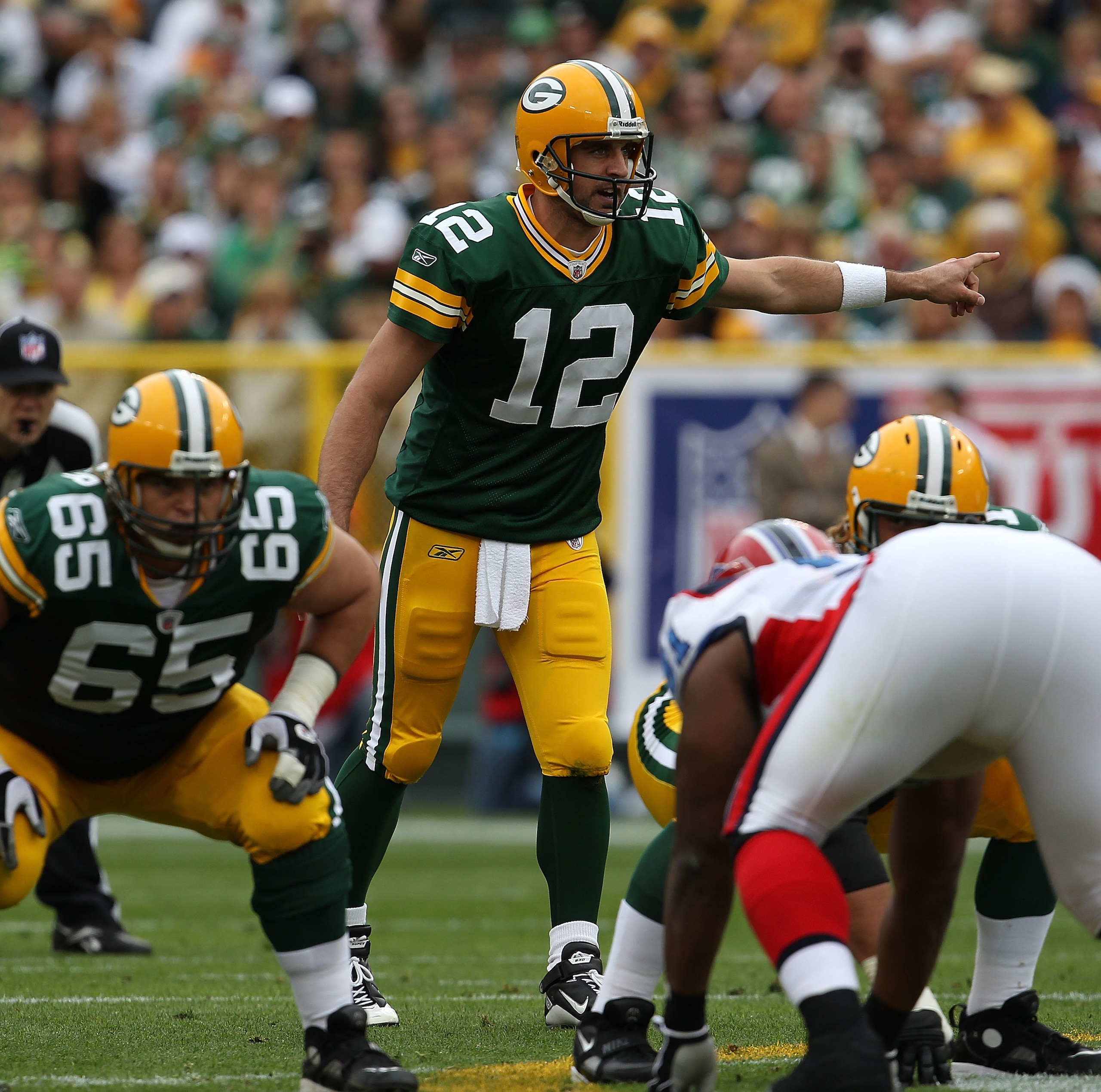 GREEN BAY, WI - SEPTEMBER 19: Aaron Rodgers #12 of the Green Bay Packers calls a play at the line of scrimmage against the Buffalo Bills at Lambeau Field on September 19, 2010 in Green Bay, Wisconsin. The Packers defeated the Bills 34-7.  (Photo by Jonath