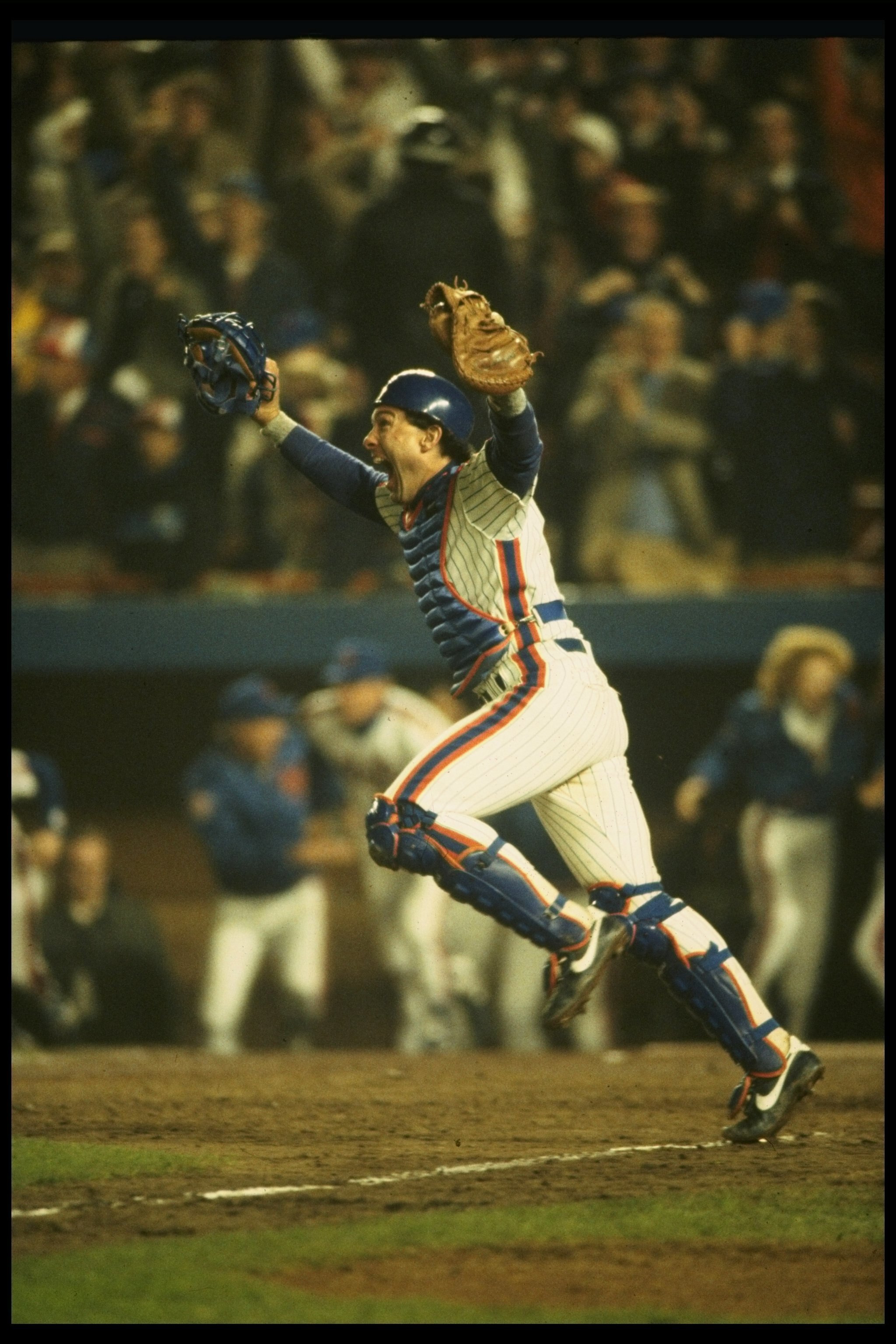 27 Oct 1986:  Catcher Gary Carter of the New York Mets celebrates after  the Mets 8-5 win over the Boston Red Sox in game 7 of the World Series at Shea Stadium in Flushing, New York.  The Mets won the series 4 games to 3. Mandatory Credit: T. G. Higgins