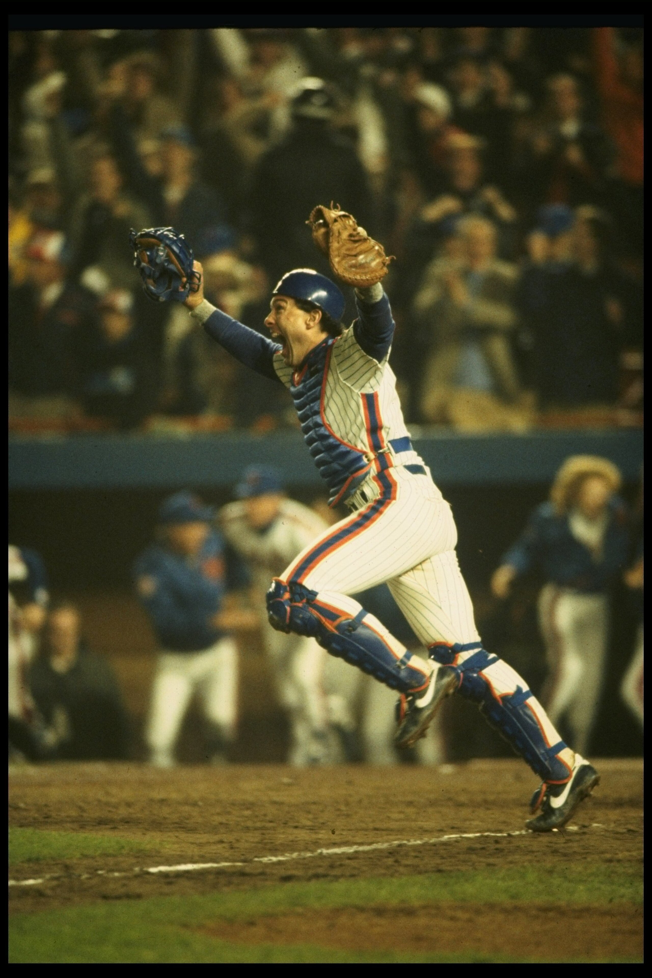 27 Oct 1986:  Catcher Gary Carter of the New York Mets celebrates after  the Mets 8-5 win over the Boston Red Sox in game 7 of the World Series at Shea Stadium in Flushing, New York.  The Mets won the series 4 games to 3. Mandatory Credit: T. G. Higgins