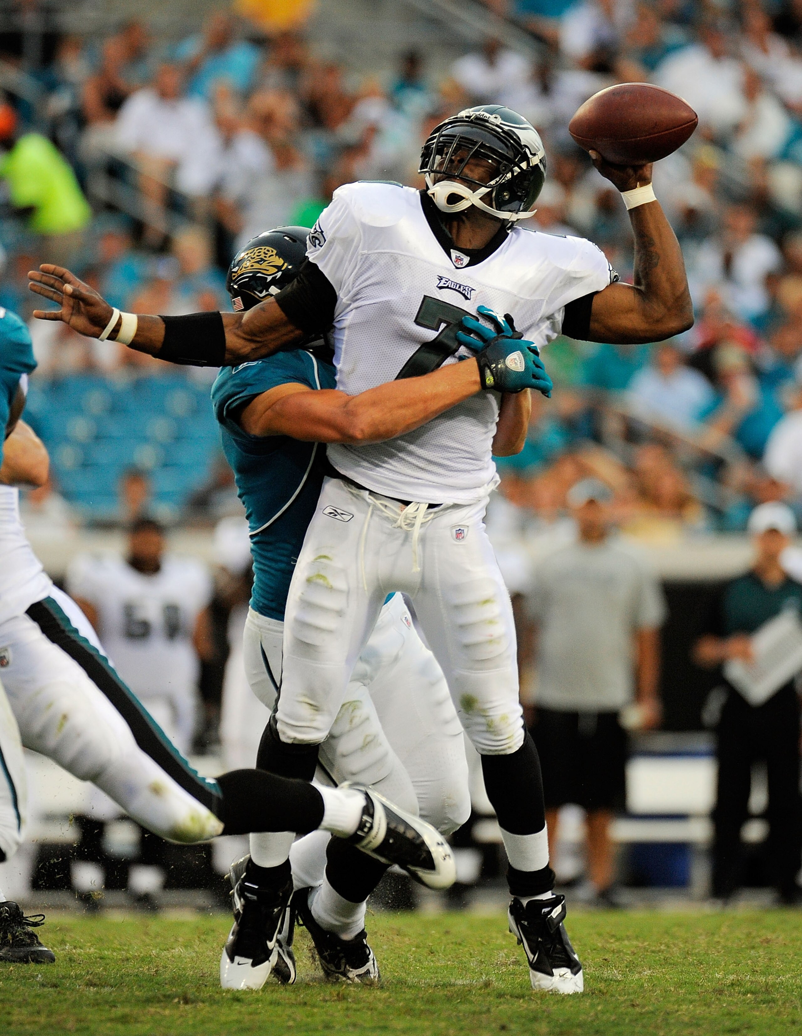 JACKSONVILLE, FL - SEPTEMBER 26:  Quarterback Michael Vick #7 of the Philadelphia Eagles is sacked by safety Sean Considine #37 of the Jacksonville Jaguars at EverBank Field on September 26, 2010 in Jacksonville, Florida. The Eagles defeated the Jaguars 2