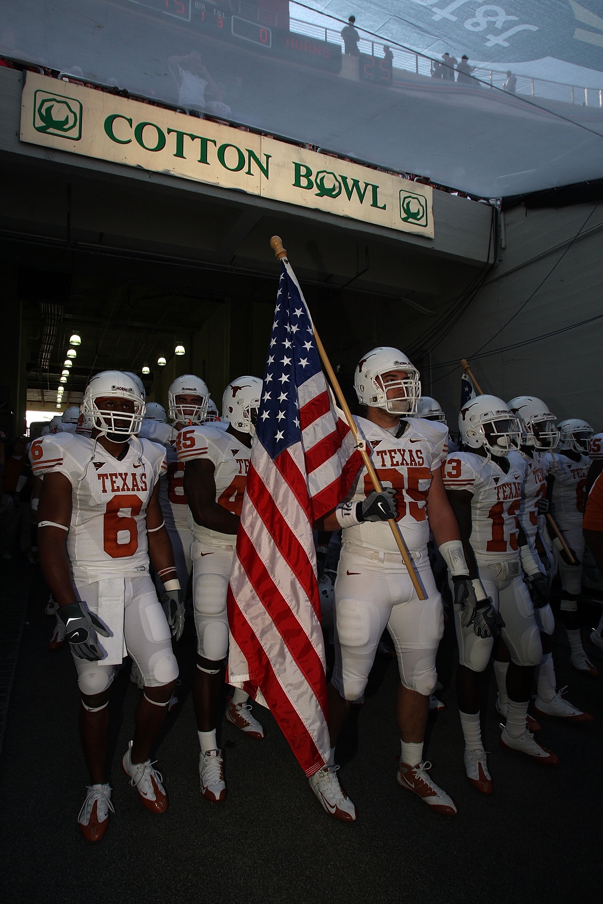 DALLAS - OCTOBER 11: Defensive end Aaron Lewis #95 the Texas Longhorns carries an enters the field before the Red River Rivalry game against the Oklahoma Sooners at the Cotton Bowl on October 11, 2008 in Dallas, Texas. (Photo by Ronald Martinez/Getty Im DALLAS - OCTOBER 11: Defensive end Aaron Lewis #95 the Texas Longhorns carries an enters the field before the Red River Rivalry game against the Oklahoma Sooners at the Cotton Bowl on October 11, 2008 in Dallas, Texas. (Photo by Ronald Martinez/Getty Im