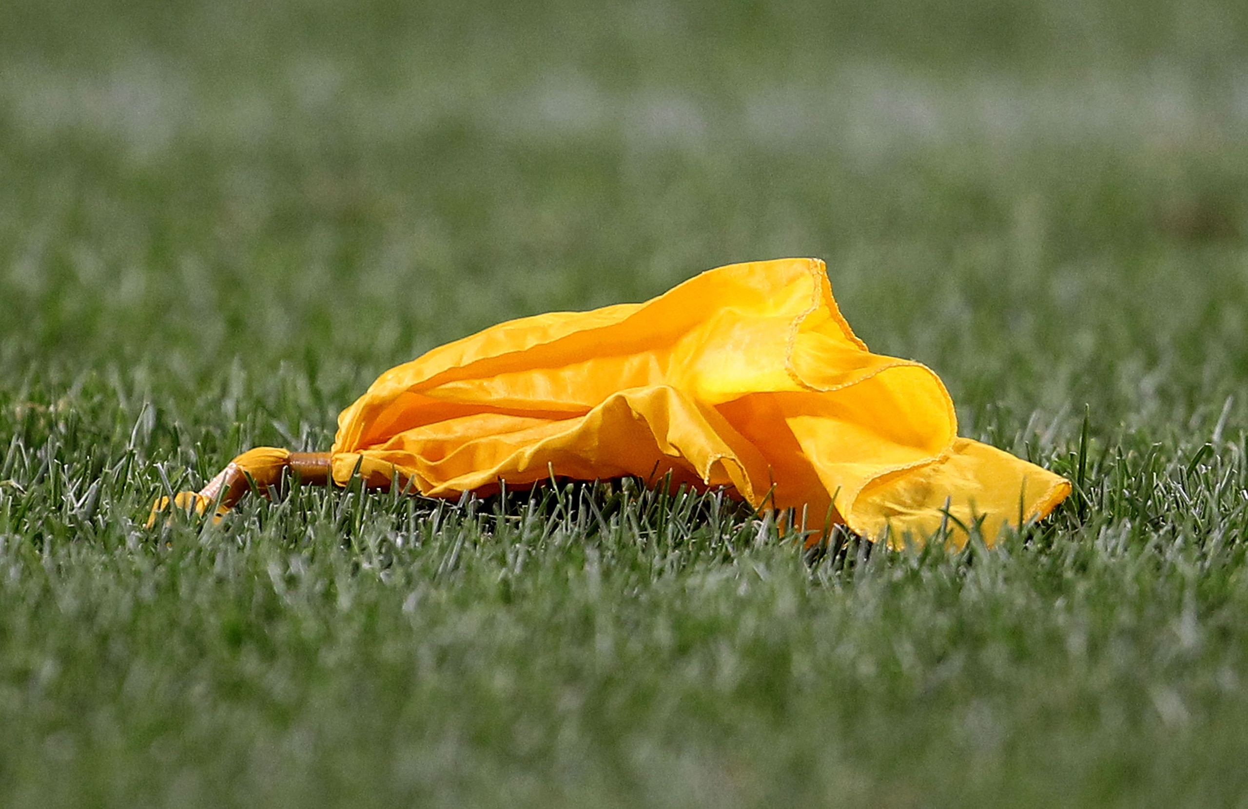 CHICAGO - AUGUST 28: A penalty flag lays on the ground during a preseason game between the Chicago Bears and the Arizona Cardinals during a preseason game at Soldier Field on August 28, 2010 in Chicago, Illinois. The Cardinals defeated the Bears 14-9. (Ph CHICAGO - AUGUST 28: A penalty flag lays on the ground during a preseason game between the Chicago Bears and the Arizona Cardinals during a preseason game at Soldier Field on August 28, 2010 in Chicago, Illinois. The Cardinals defeated the Bears 14-9. (Ph